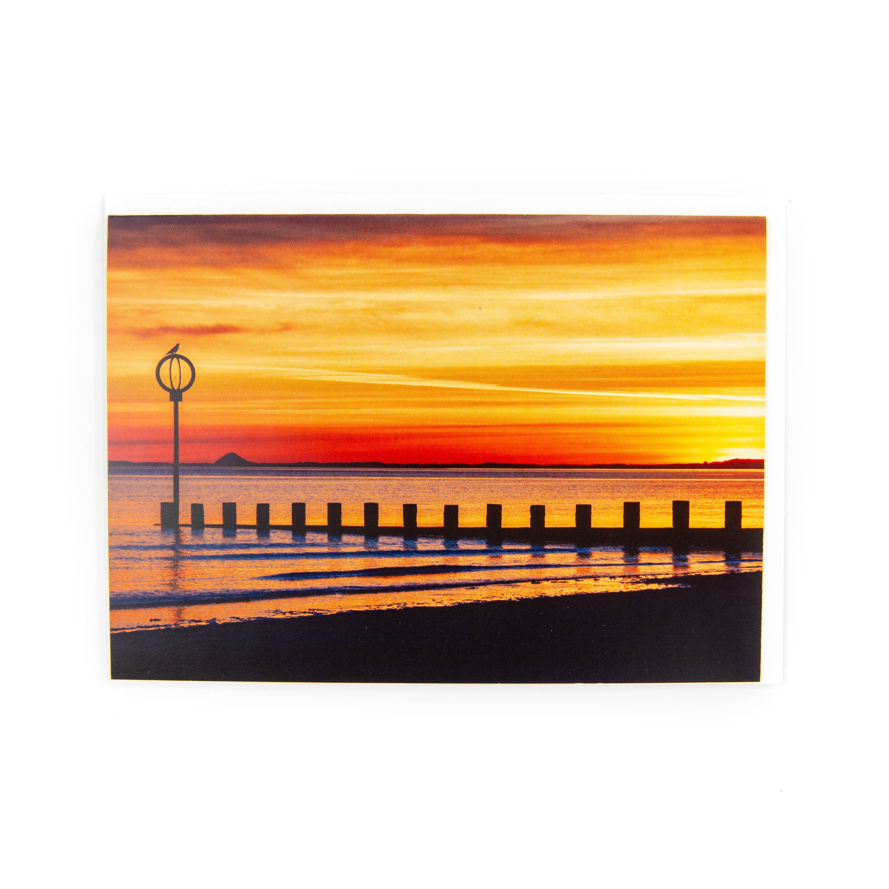 A greeting card depicting a sunset at Portobello Beach.