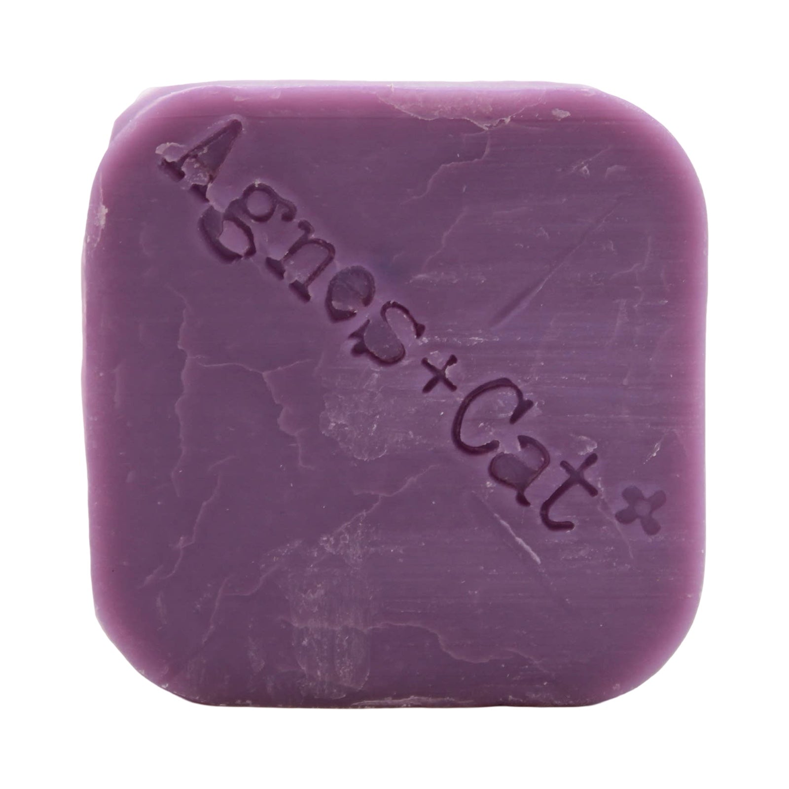 A square-shaped purple, pressed peonies scented dry shampoo bar 