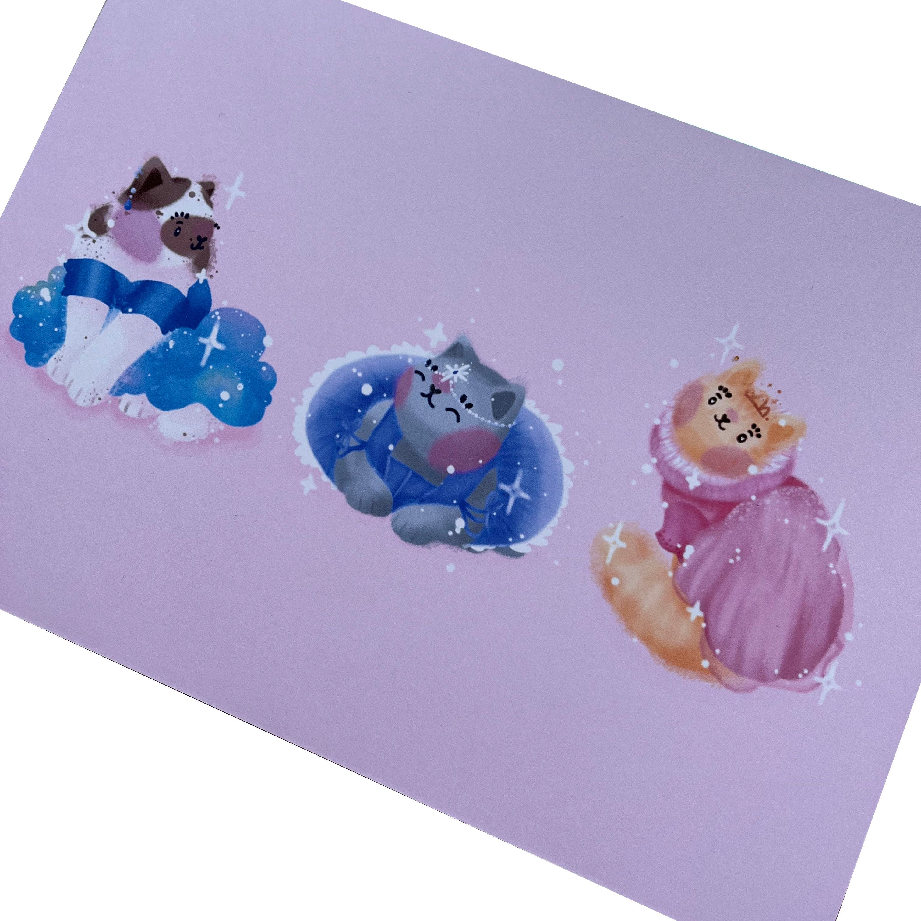 Art print of three princess cats in ballgowns of blue, purple and pink, on a pink background. Each cat has a different dress design, and different jewellery and headwear.
