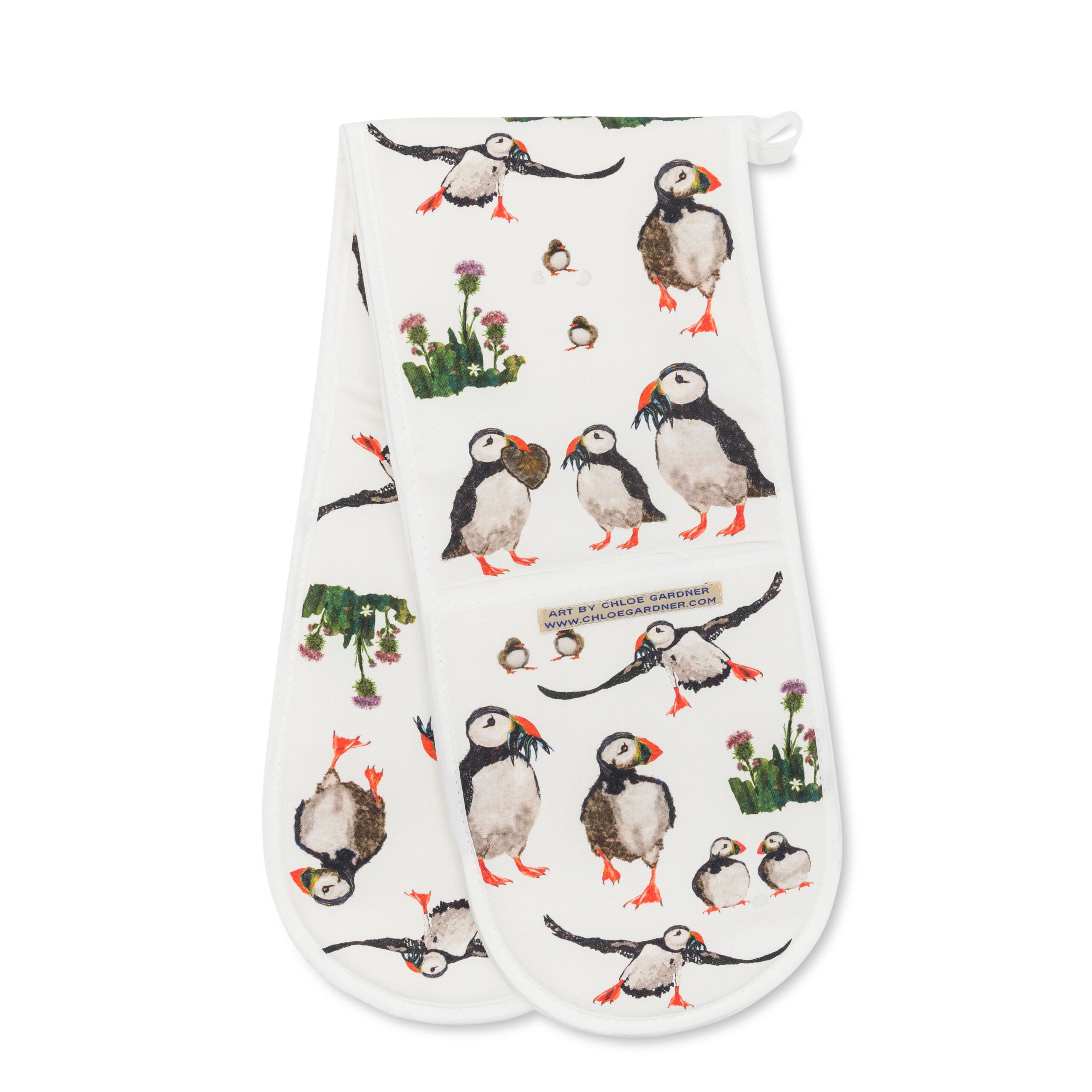 White oven gloves featuring multiple puffins, flying and standing and clusters of thistles.