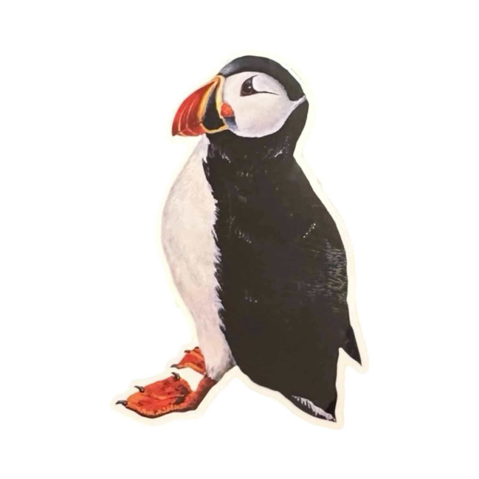 This vinyl puffin-shaped sticker features an illustration of a standing puffin facing to the left. 