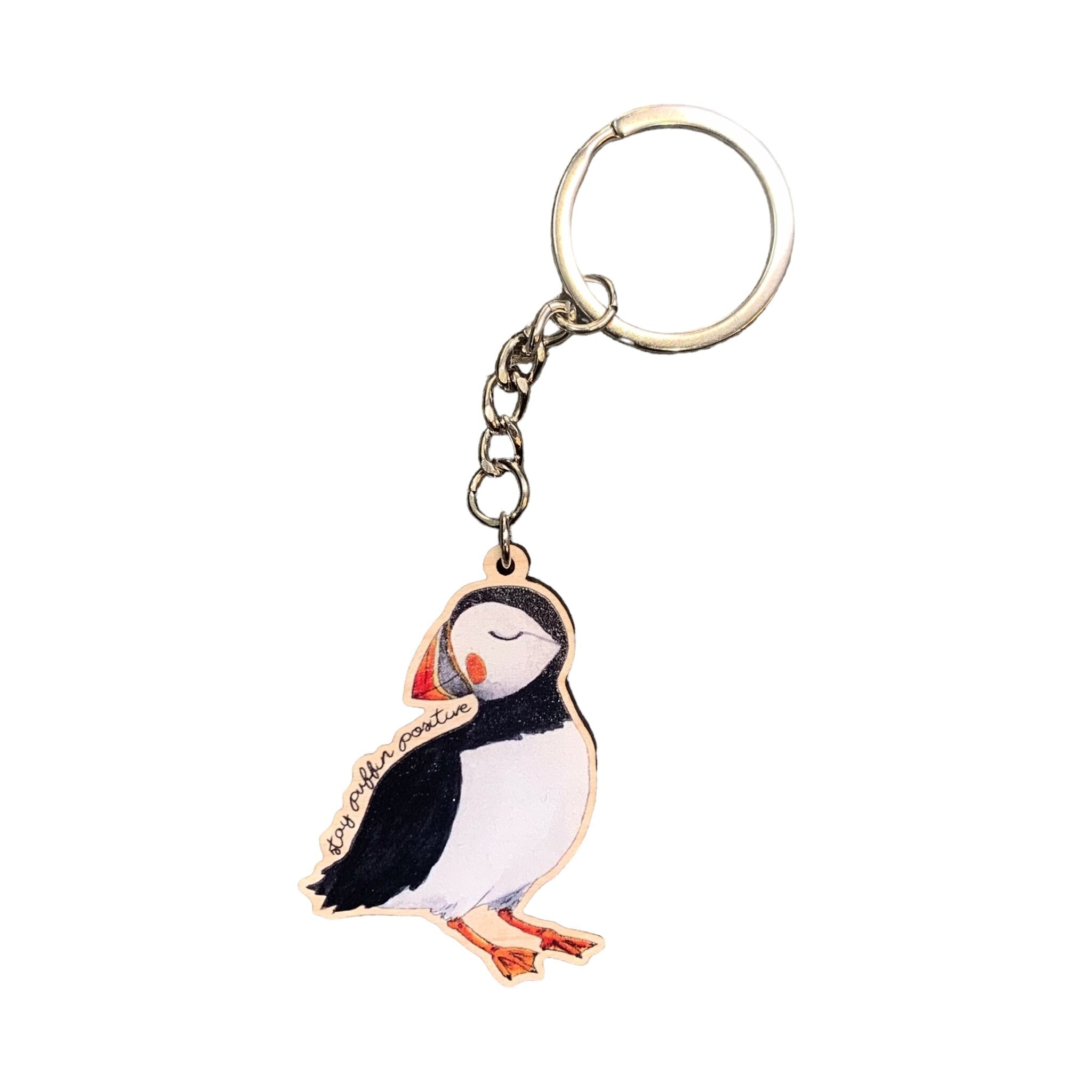 A wooden keying of a puffin.