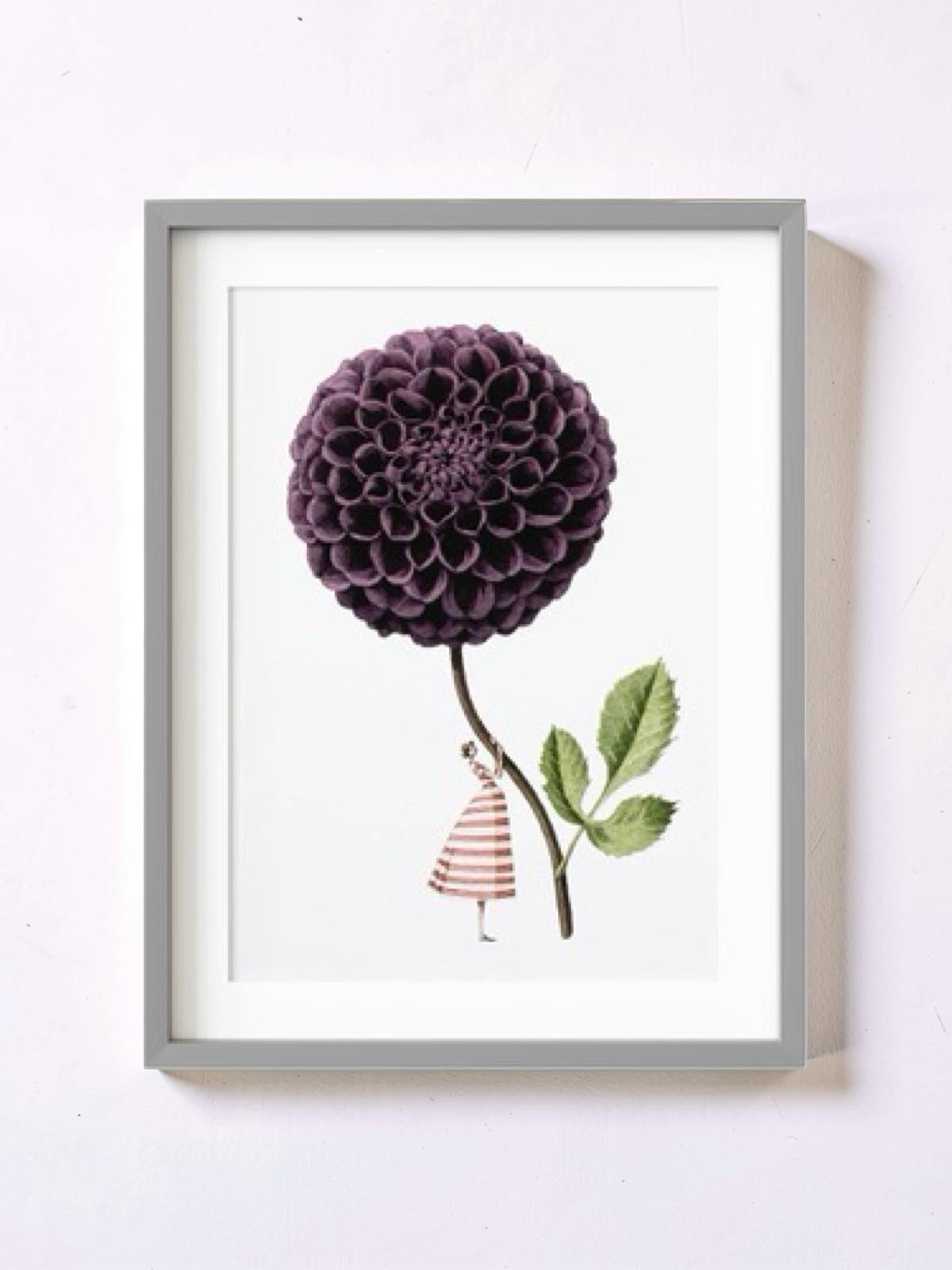 Framed artwork with a purple flower and small figure on a white background.