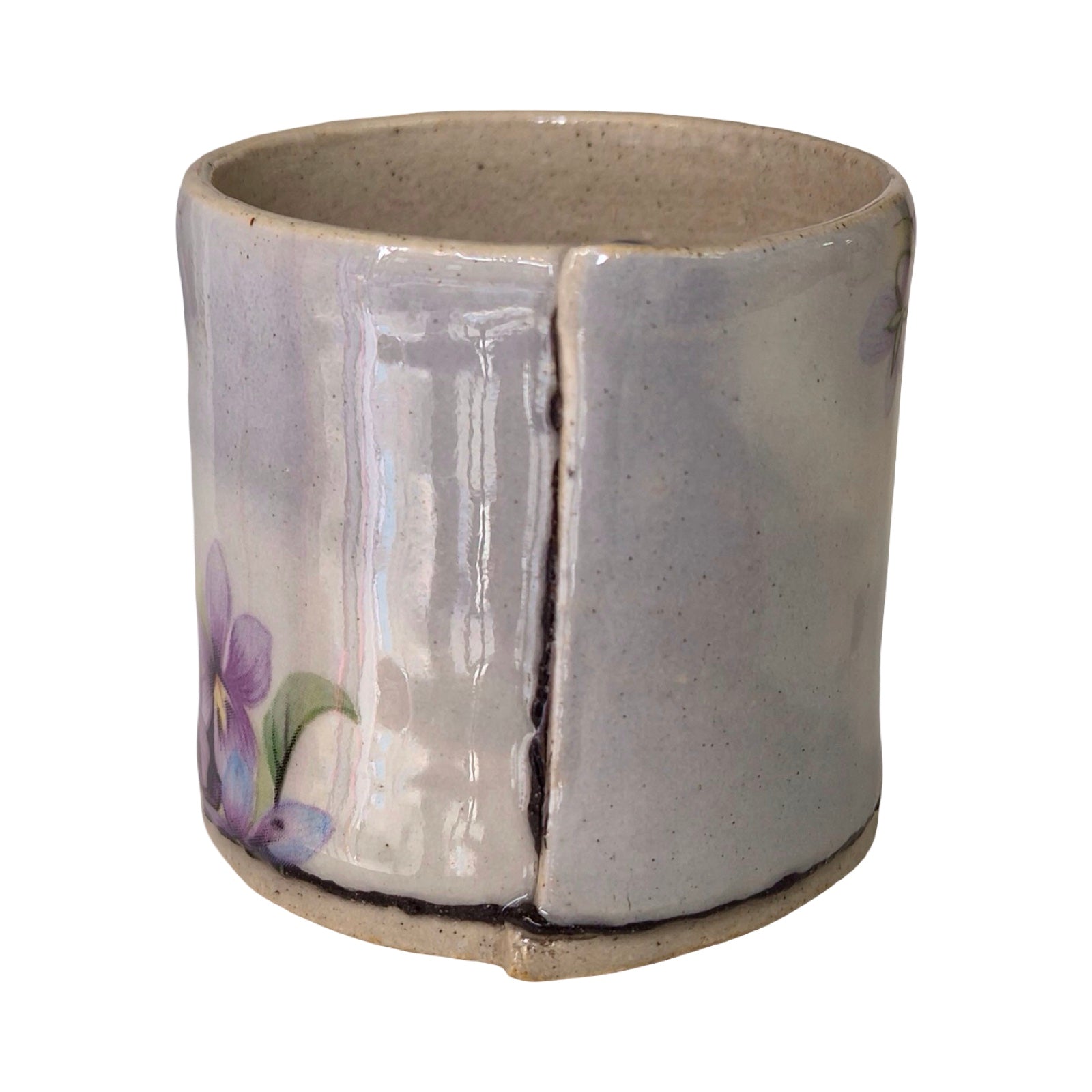 Ceramic planter with a floral design on a white background.