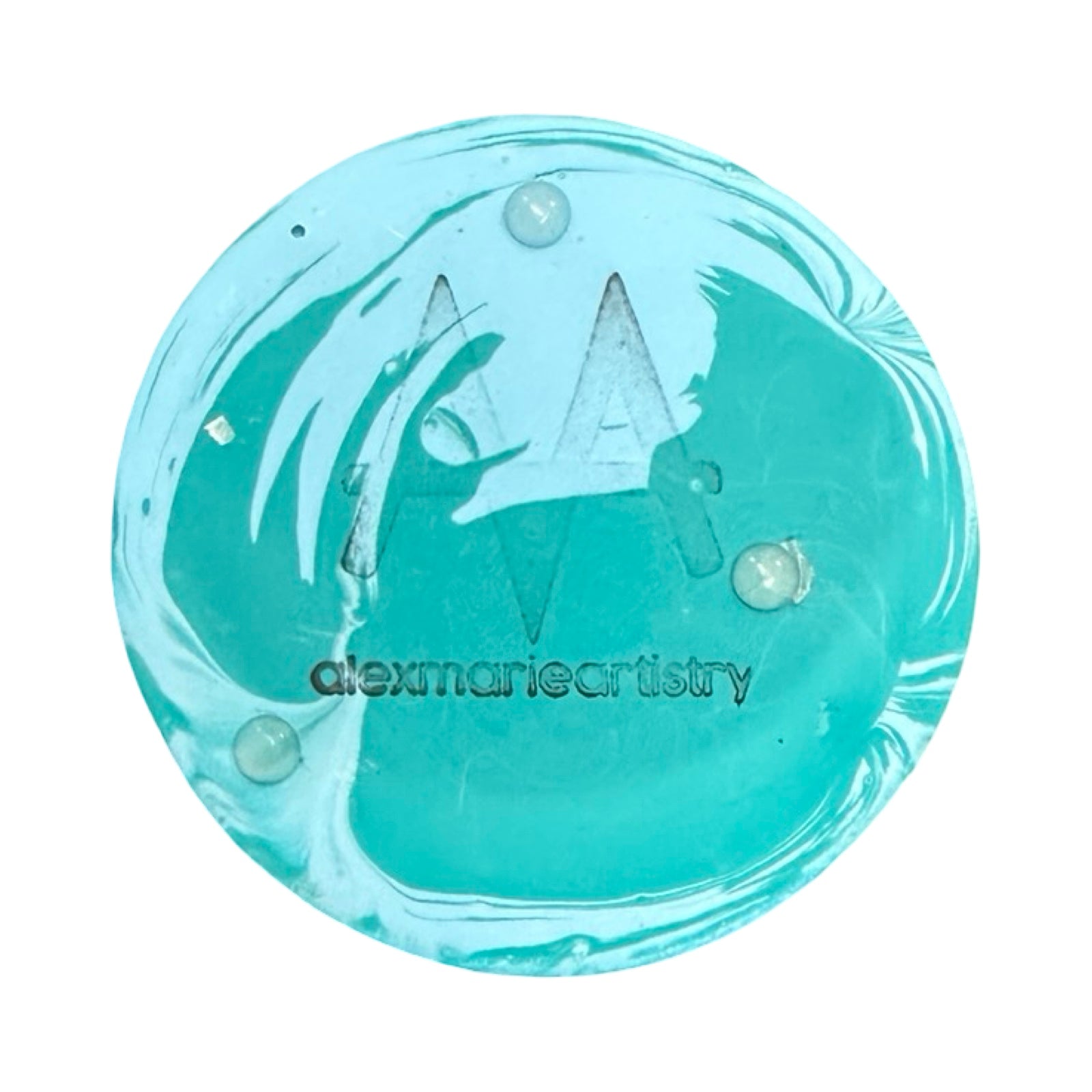 Round turquoise object with 'alexmarieartistry' branding on a white background.