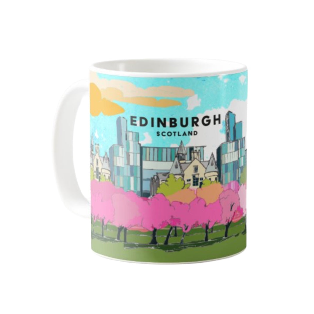 Classic mug featuring a striking panoramic artwork of the cherry blossoms in The meadows with the Quarter Mile area, Edinburgh