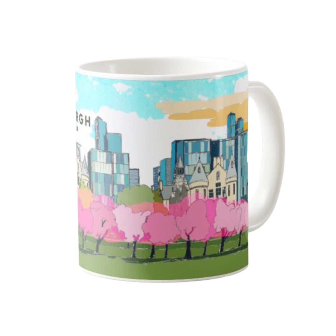 Classic mug featuring a striking panoramic artwork of the cherry blossoms in The meadows with the Quarter Mile area, Edinburgh