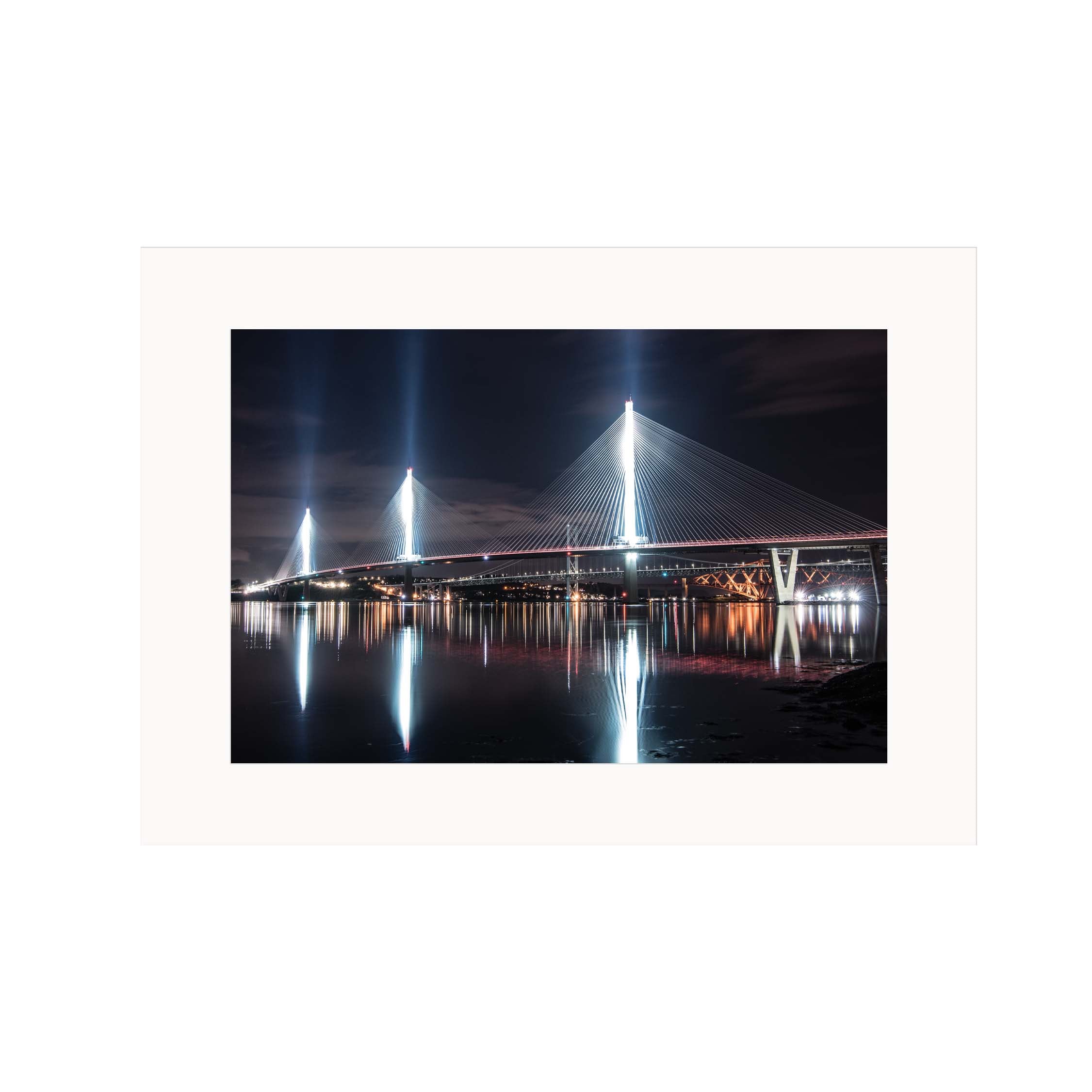 An image of the Queensferry Crossing at night in a mount. 