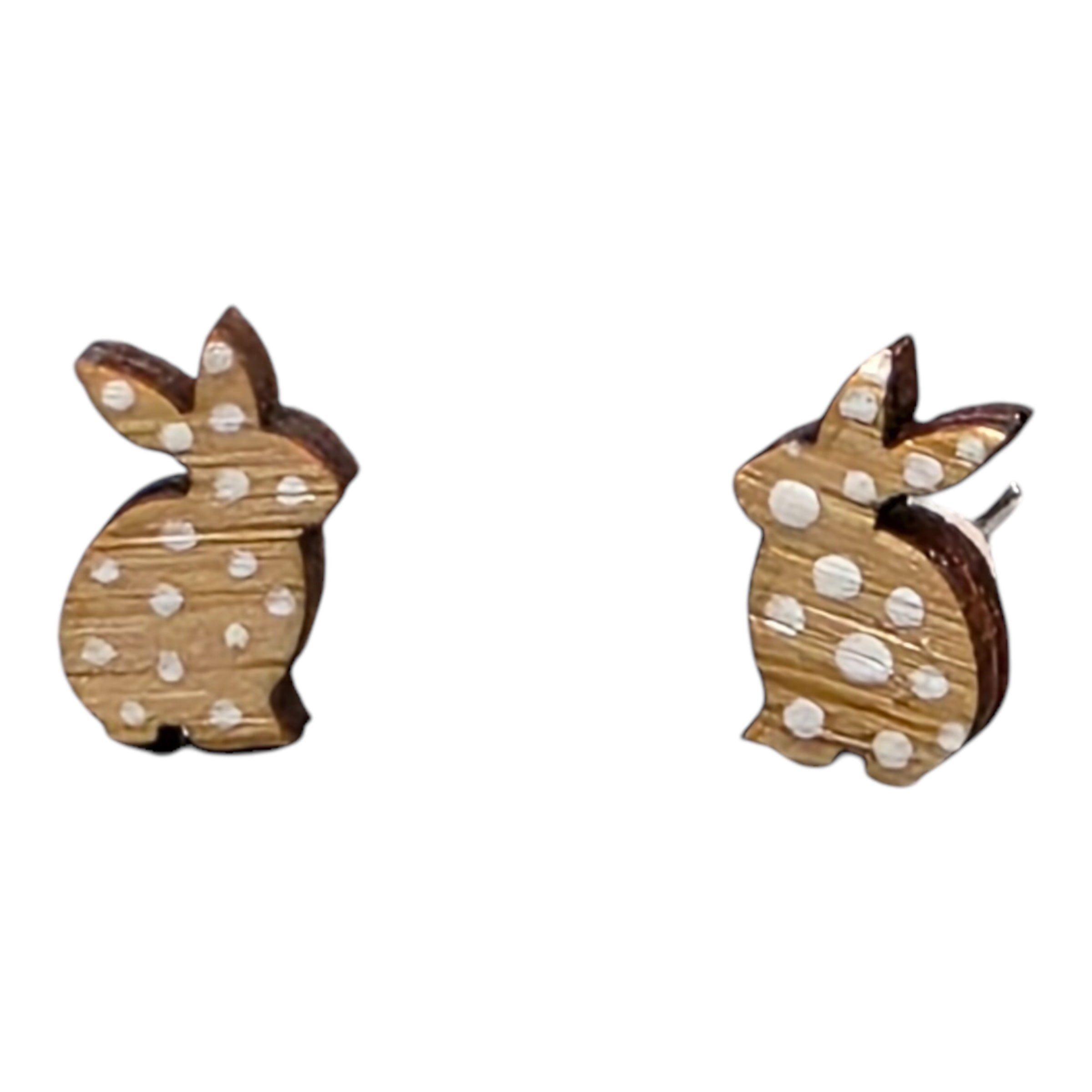 Rabbit-shaped stud earrings with white spots.