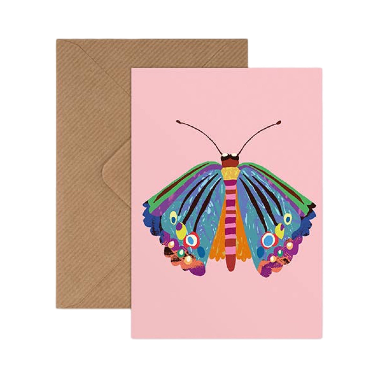 A pink greeting card featuring a colourful butterfly illustration, shown with a brown kraft envelope behind it on a white background.
