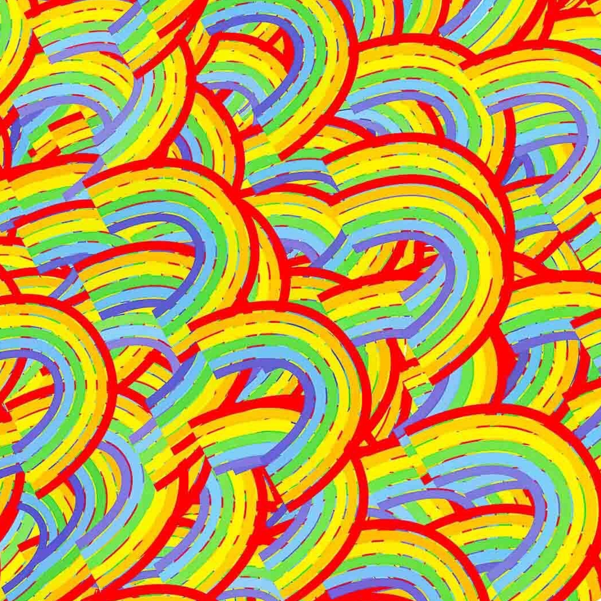 Wrapping paper with a vibrant, multicolored rainbow pattern.