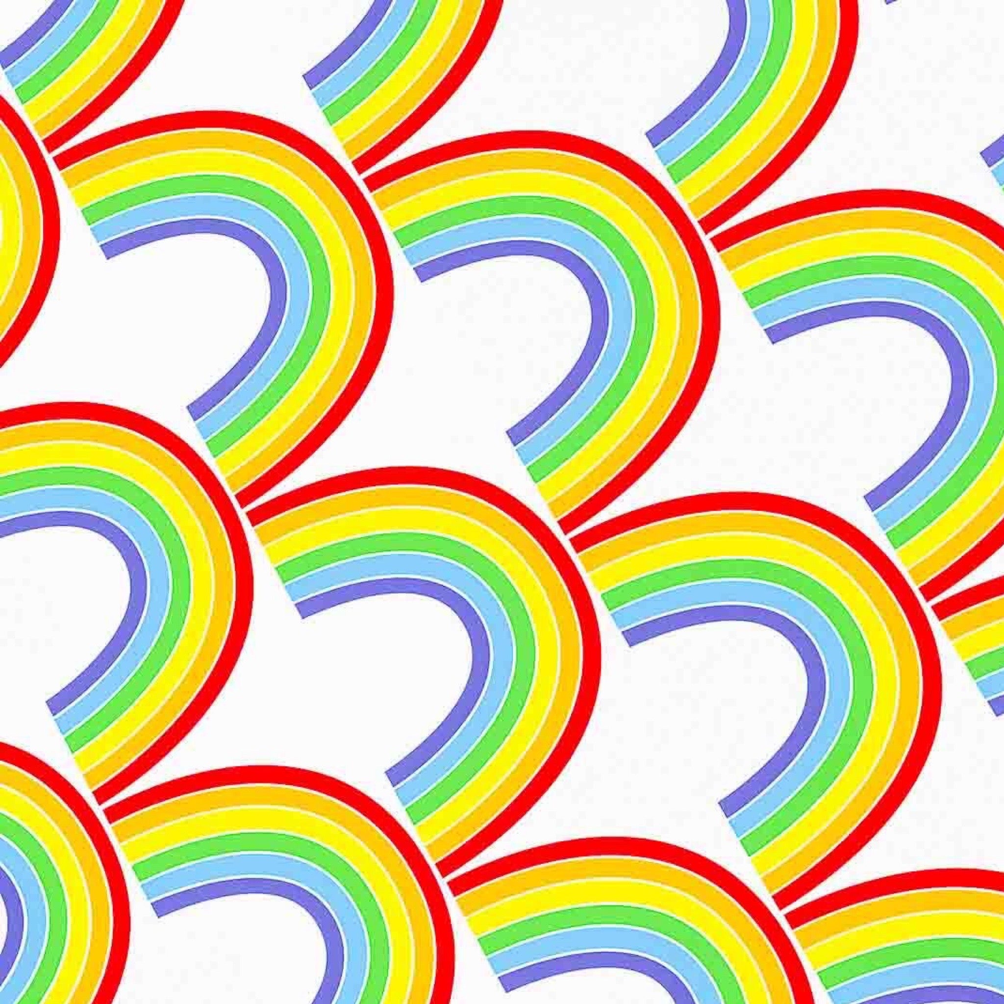 A sheet of wrapping paper with a repeated rainbow pattern in vibrant colors against a white background.
