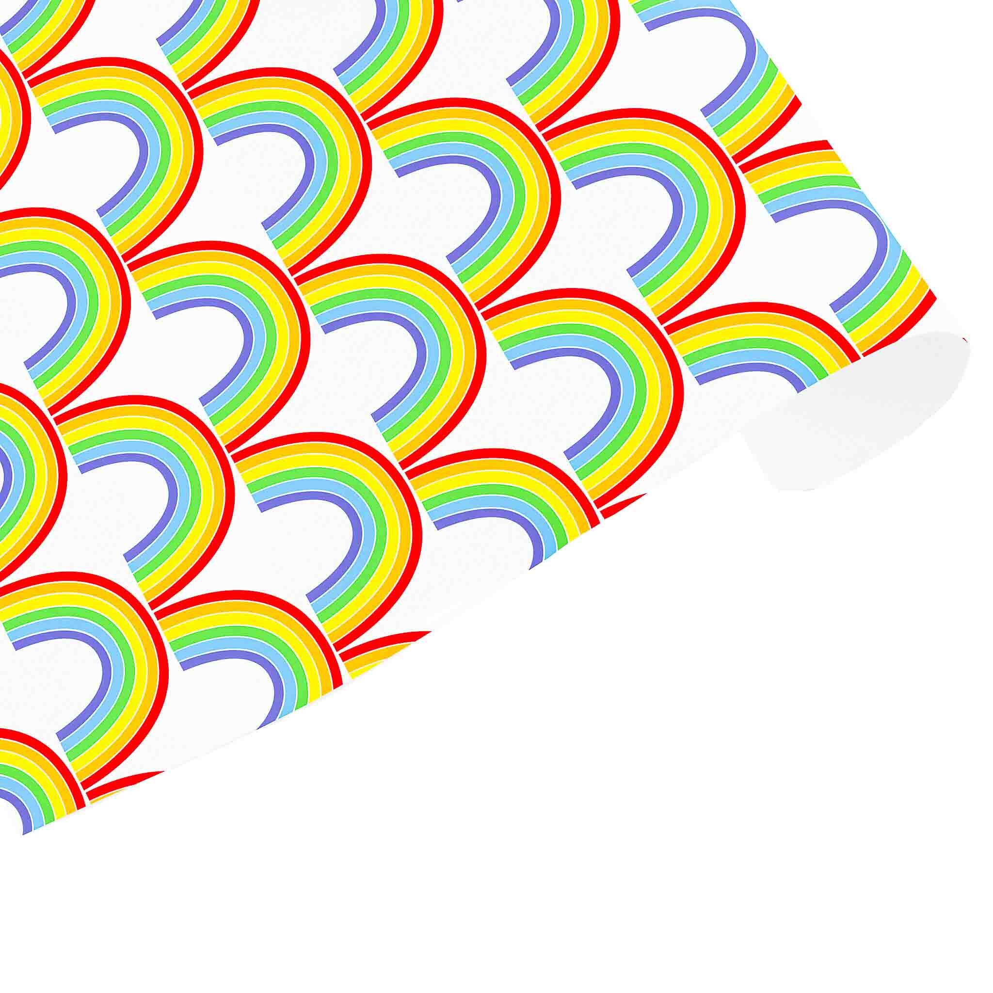 A sheet of wrapping paper with a repeated rainbow pattern in vibrant colors against a white background.