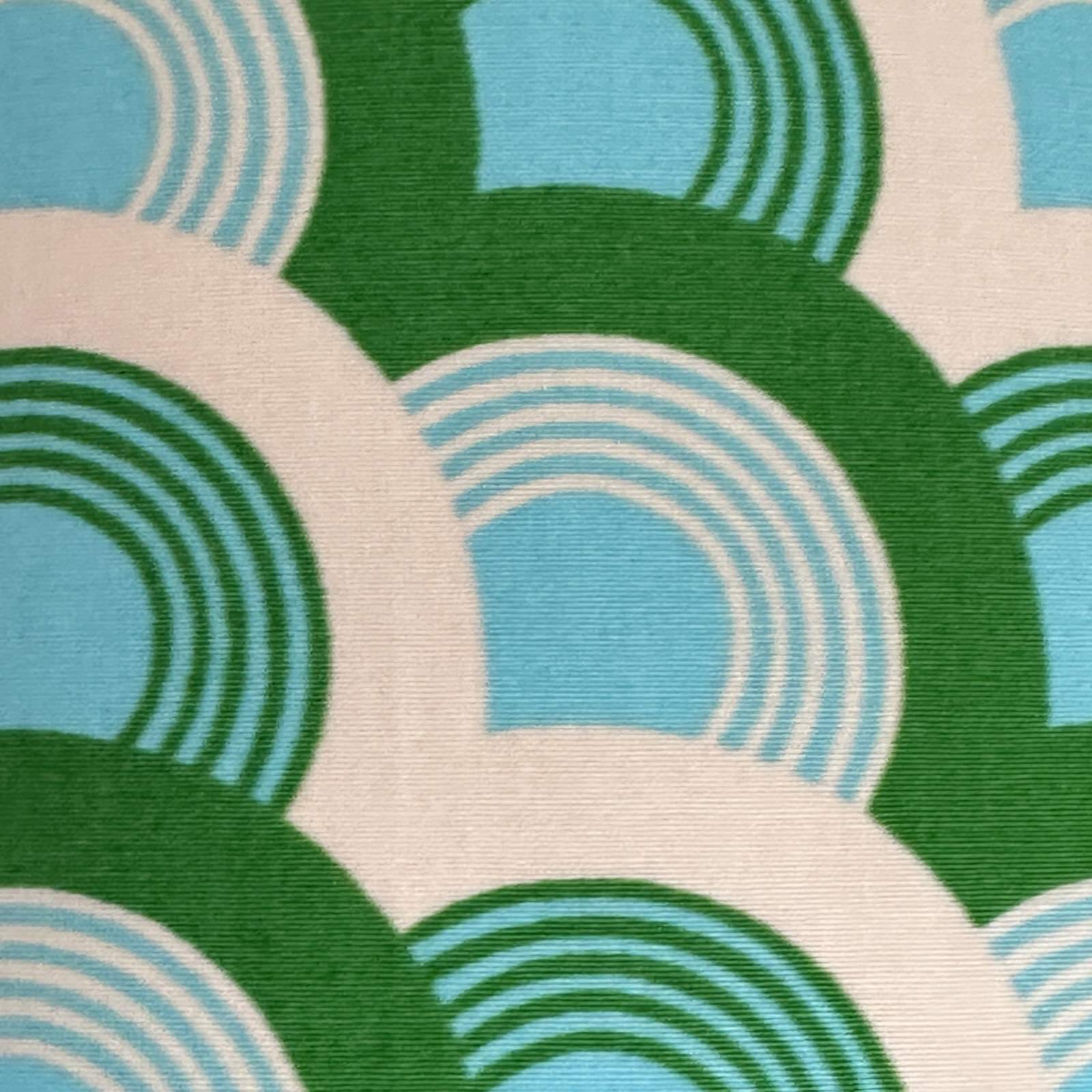 Fabric with green, turquoise and white rainbows