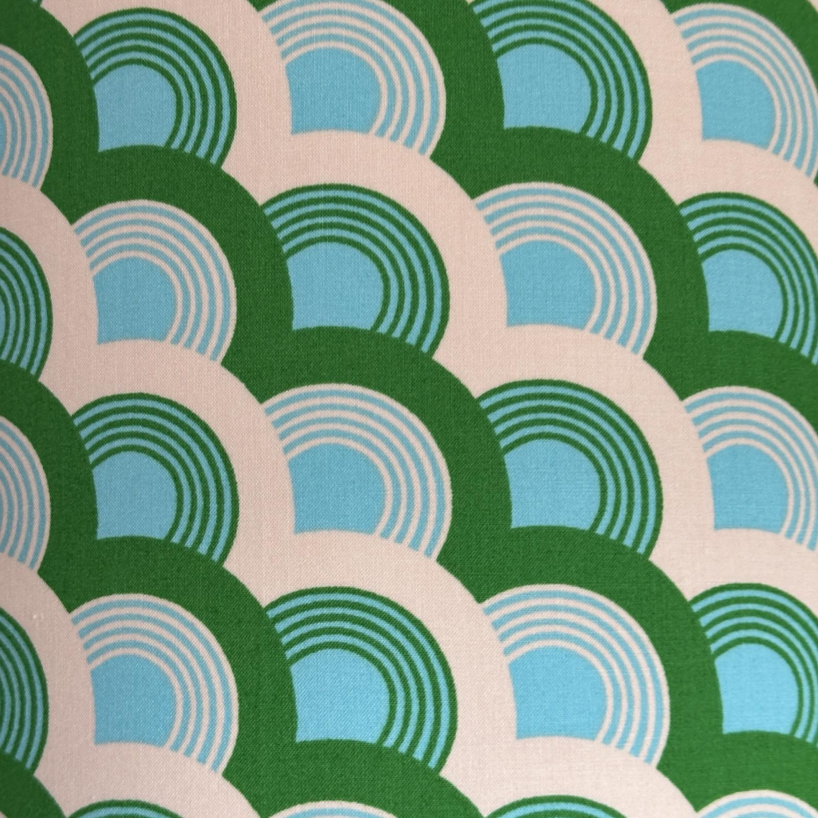 Fabric with green, turquoise and white rainbows