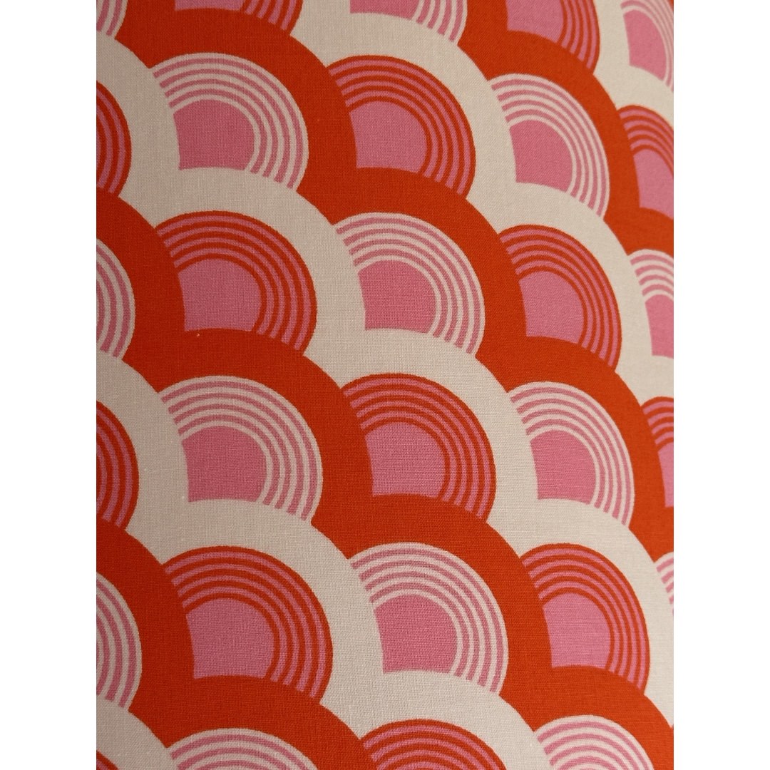 Fabric in red, pink and white rainbows
