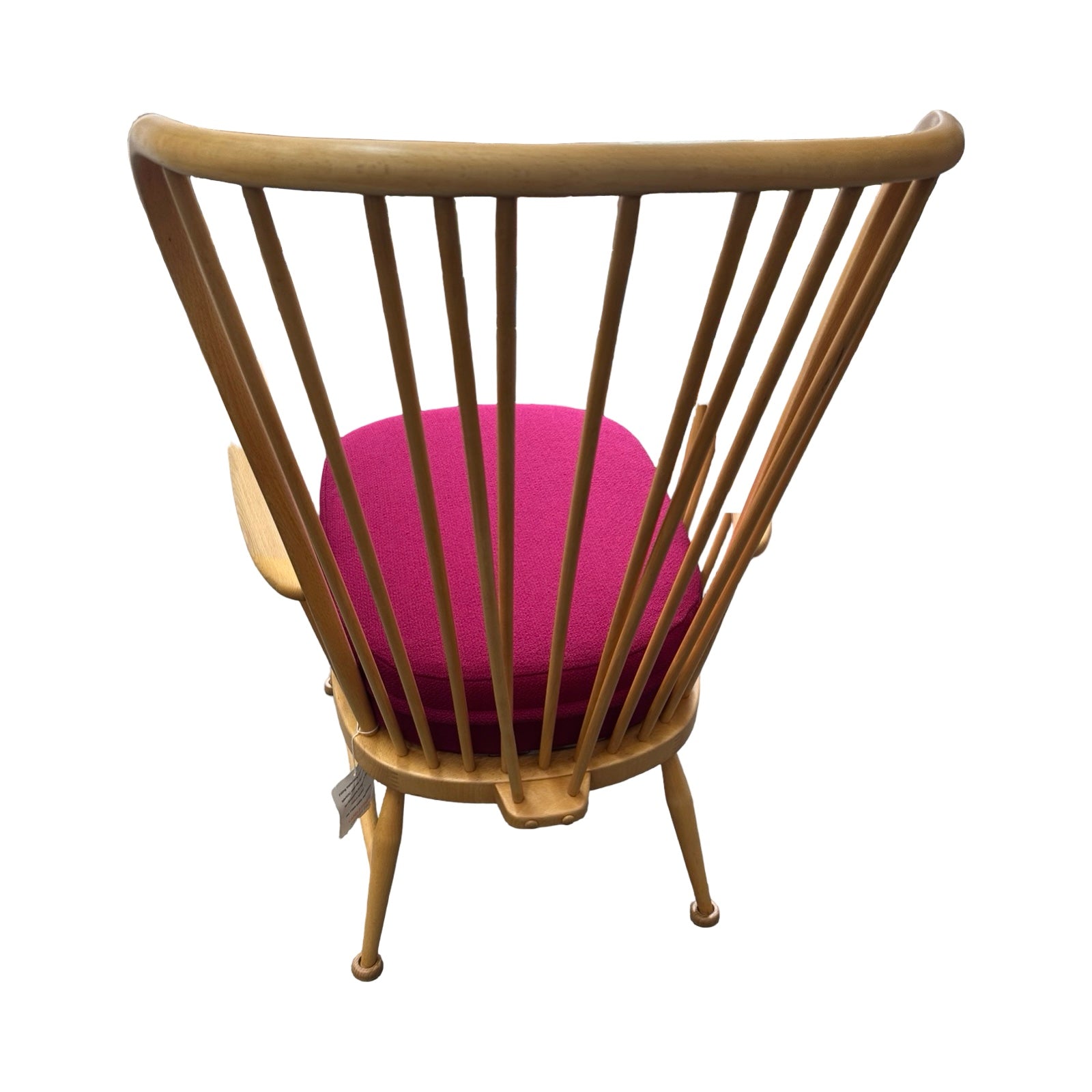 Chair with wooden backrest and pink cushion on a white background