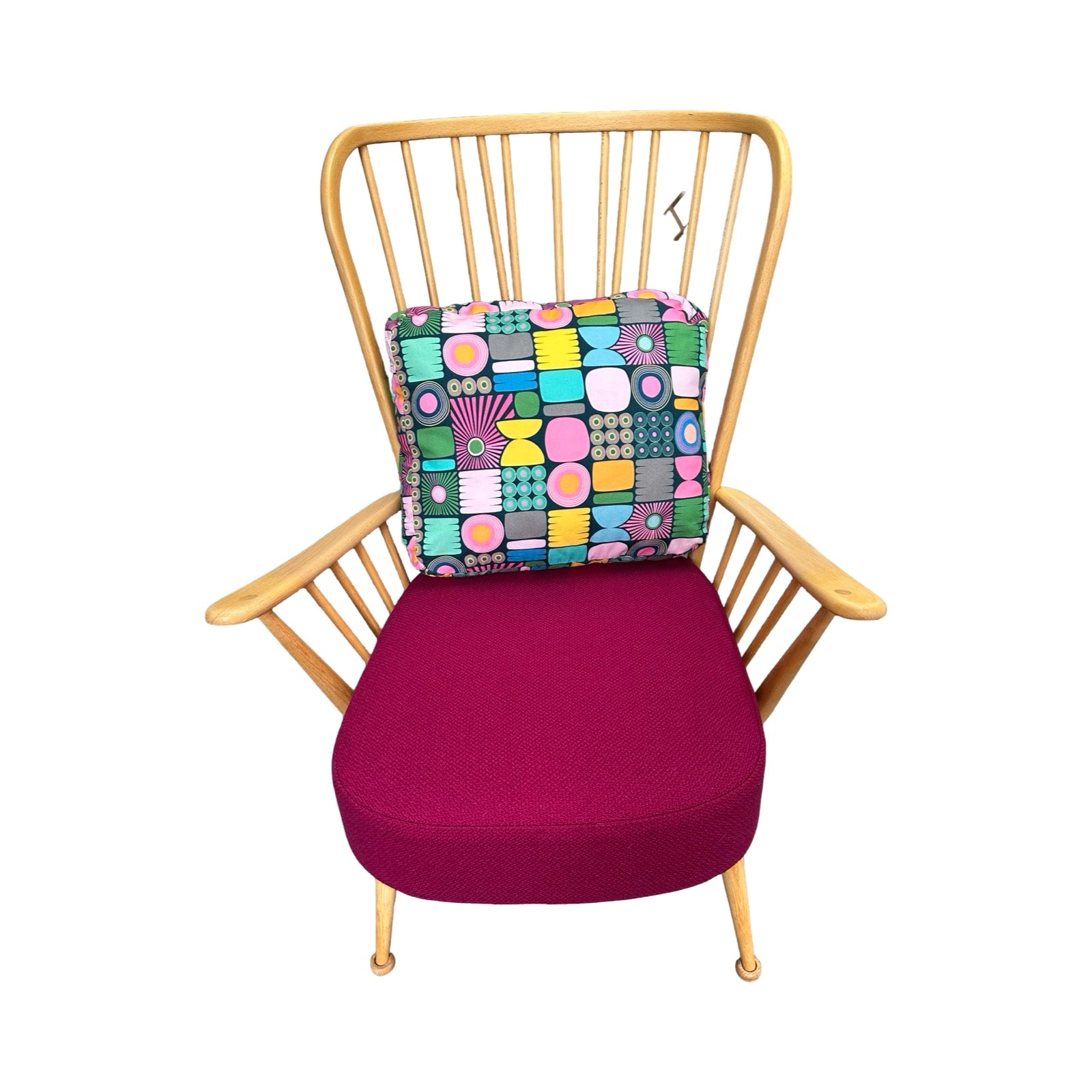 Chair with a colorful geometric cushion on a white background