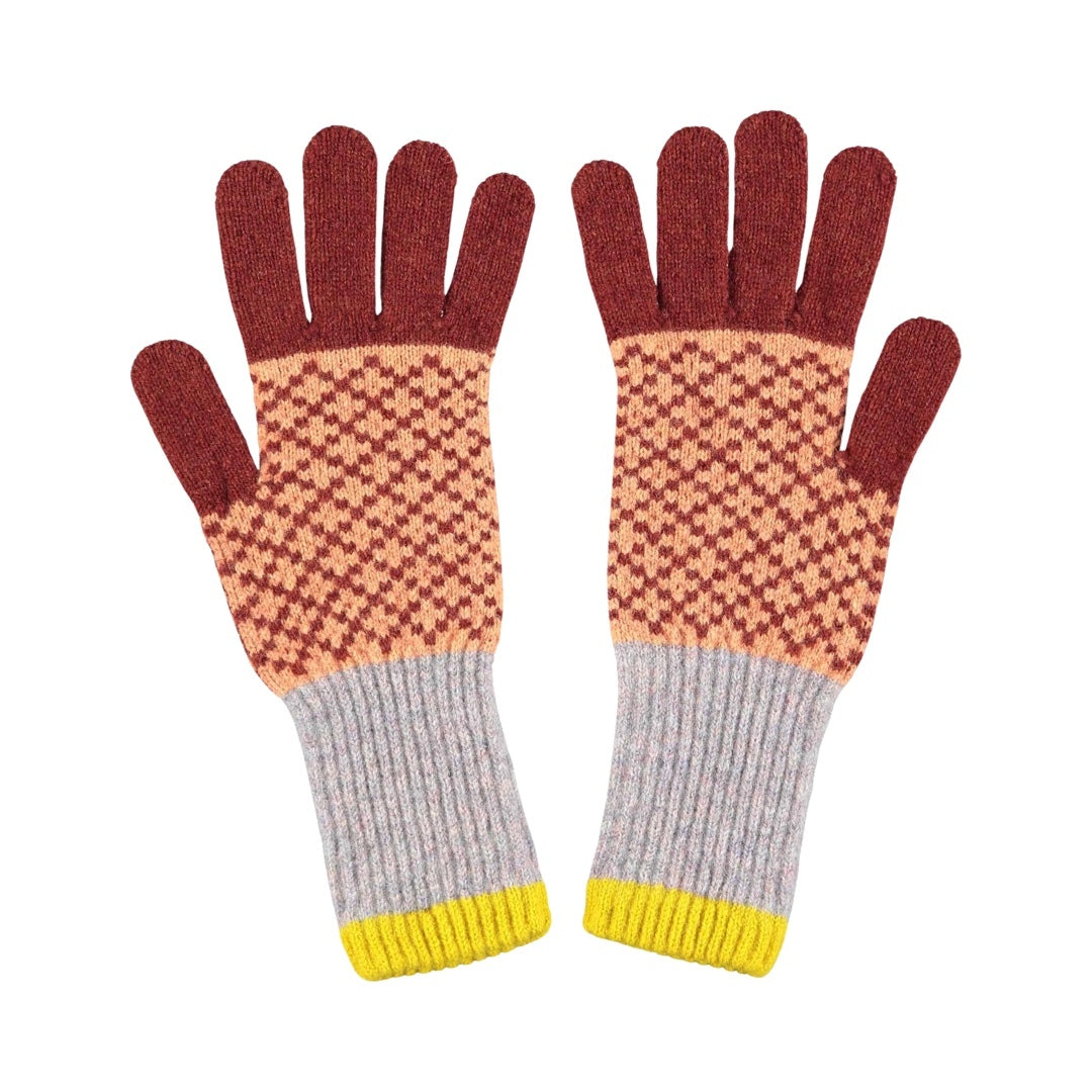 Lambswool gloves in rust with a peach diamond pattern and grey and yellow cuffs.