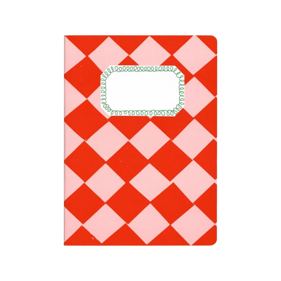 An A5 red and pale pink checked notebook.