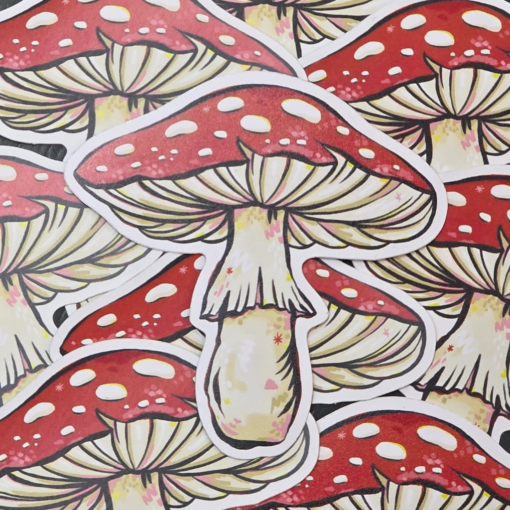 Pile of red and white mushrooms with a beige stem on a matching background.