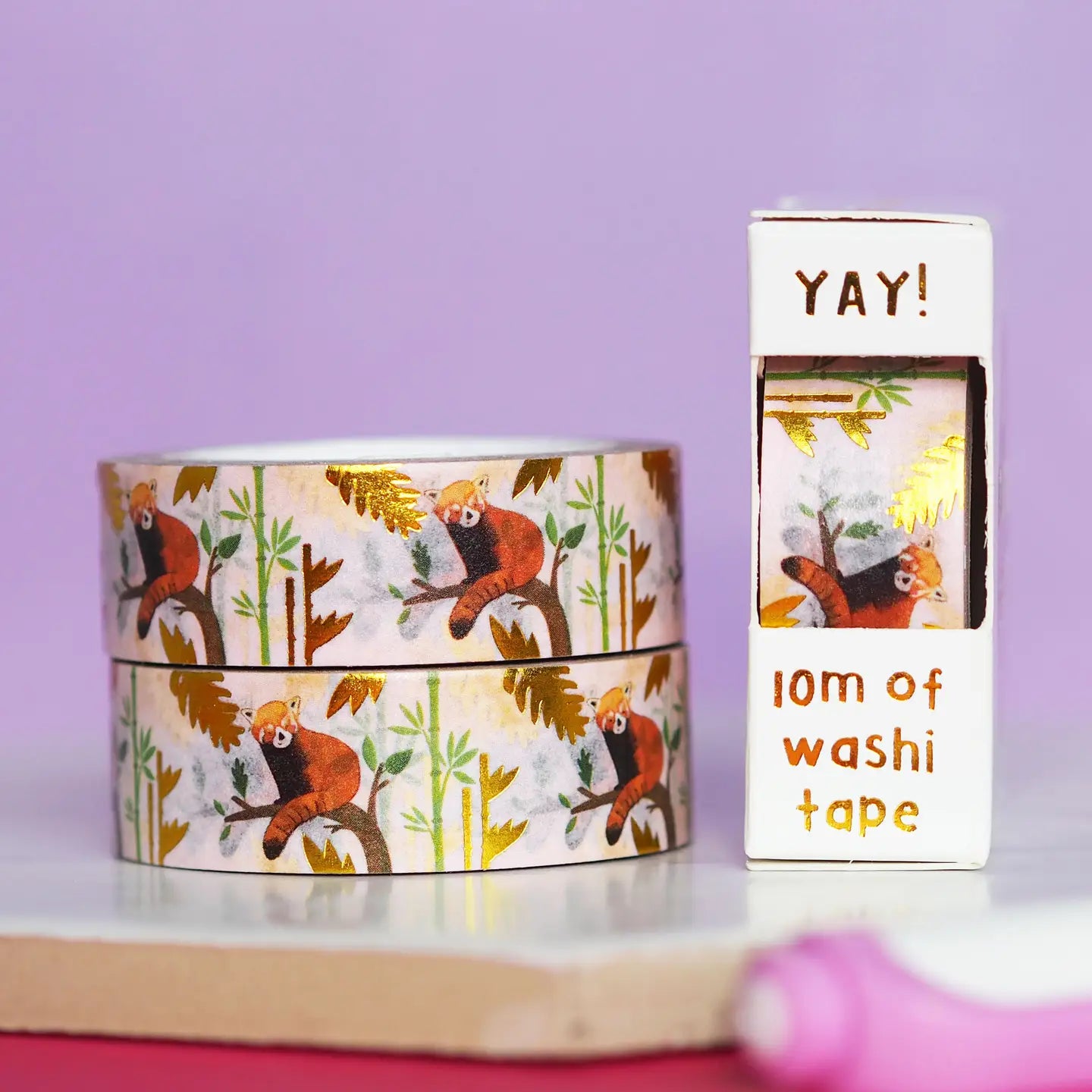 Washi tape with red panda design and a box labeled 'YAY!' on a purple background.