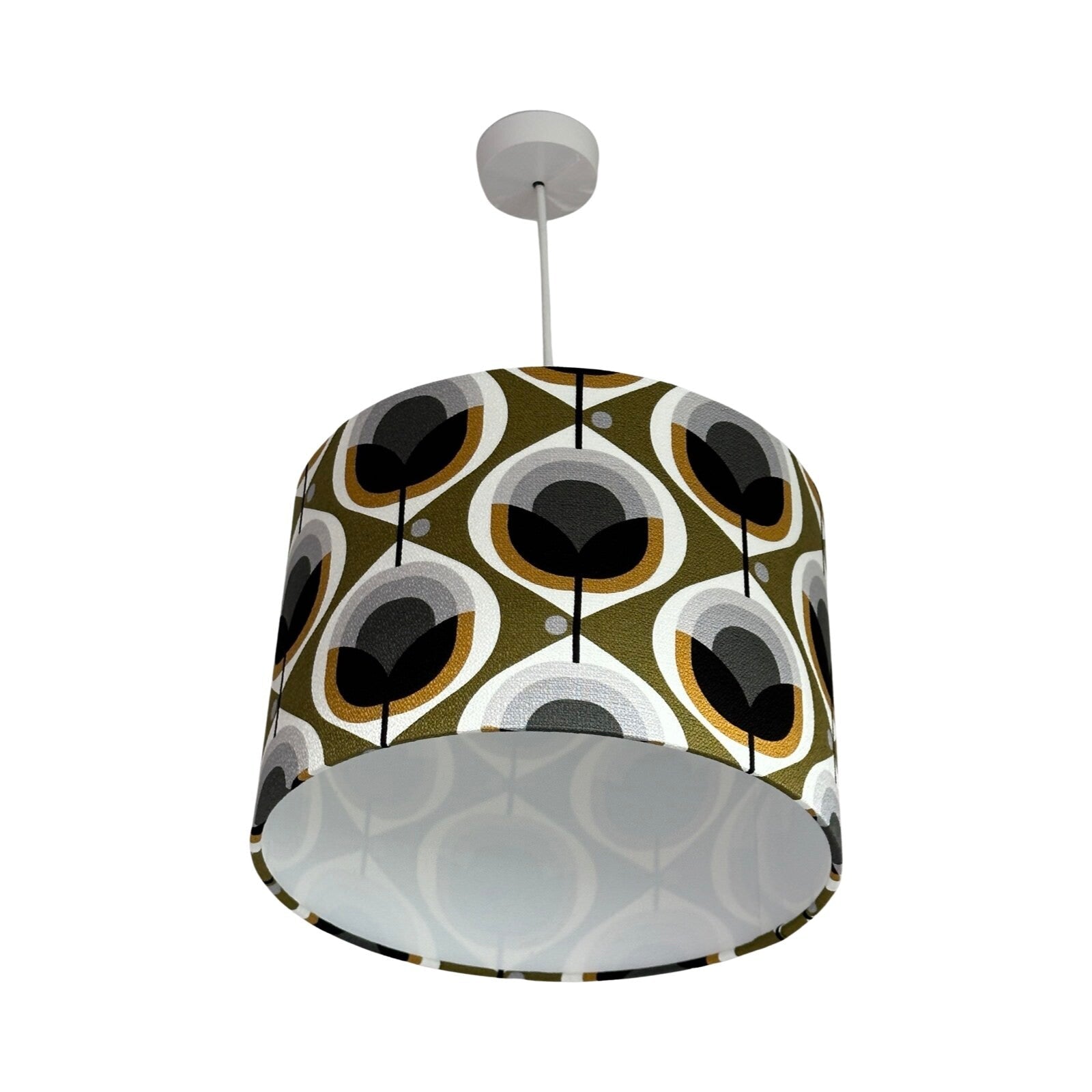 Drum lampshade covered in mid-century inspired floral barkcloth fabric in mustard, black, white and grey.