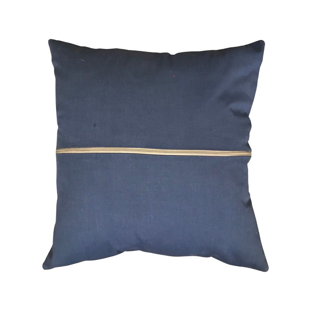 This cushion cover with a navy cotton back with a grey zip.