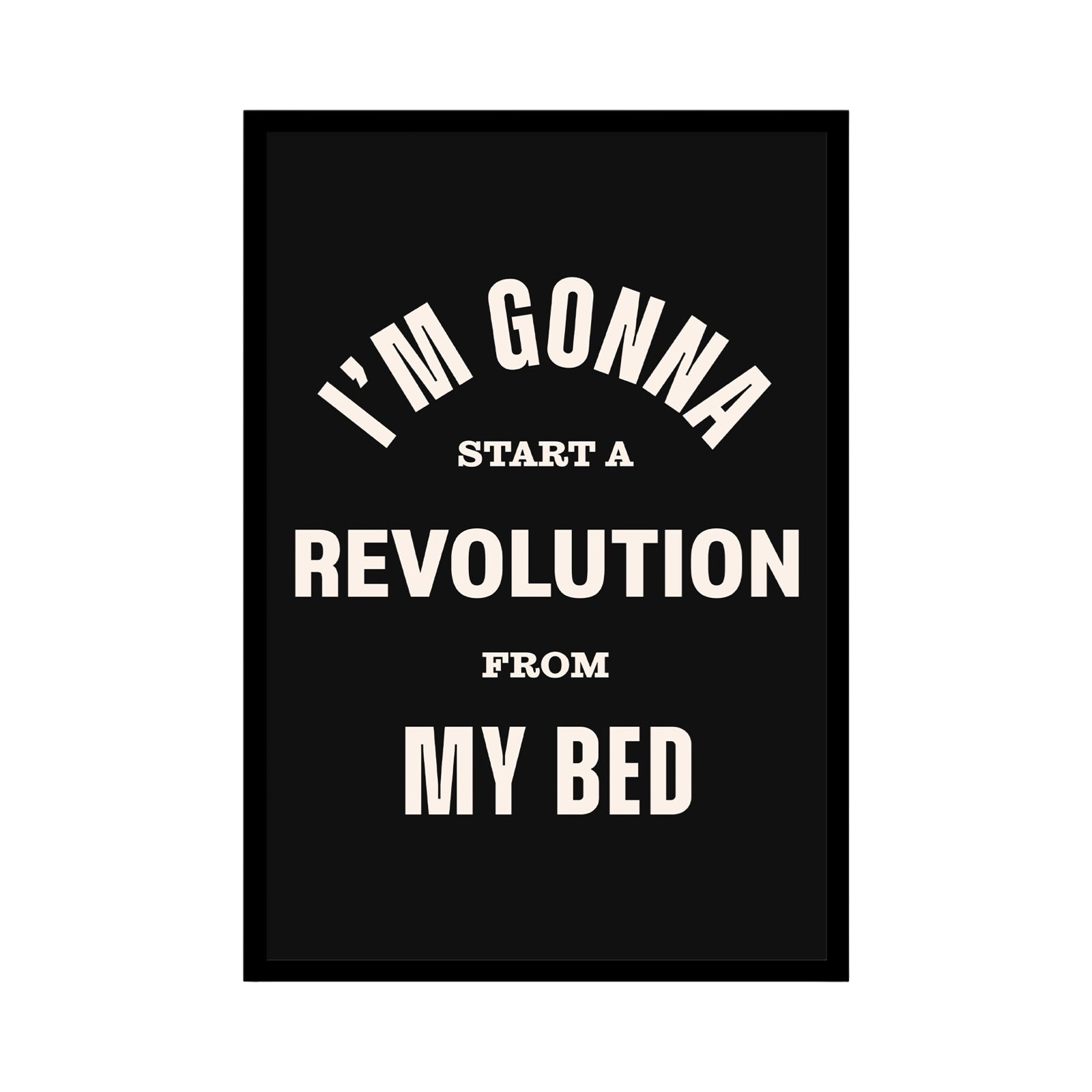 Print of the lyric 'I'm gonna start a revolution from my bed' from the song Don't Look Back in Anger by Oasis. The lyrics are written in white against a black background.