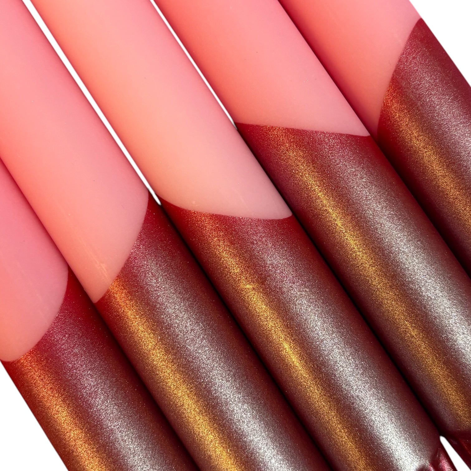 Close-up of metallic candles on a white background