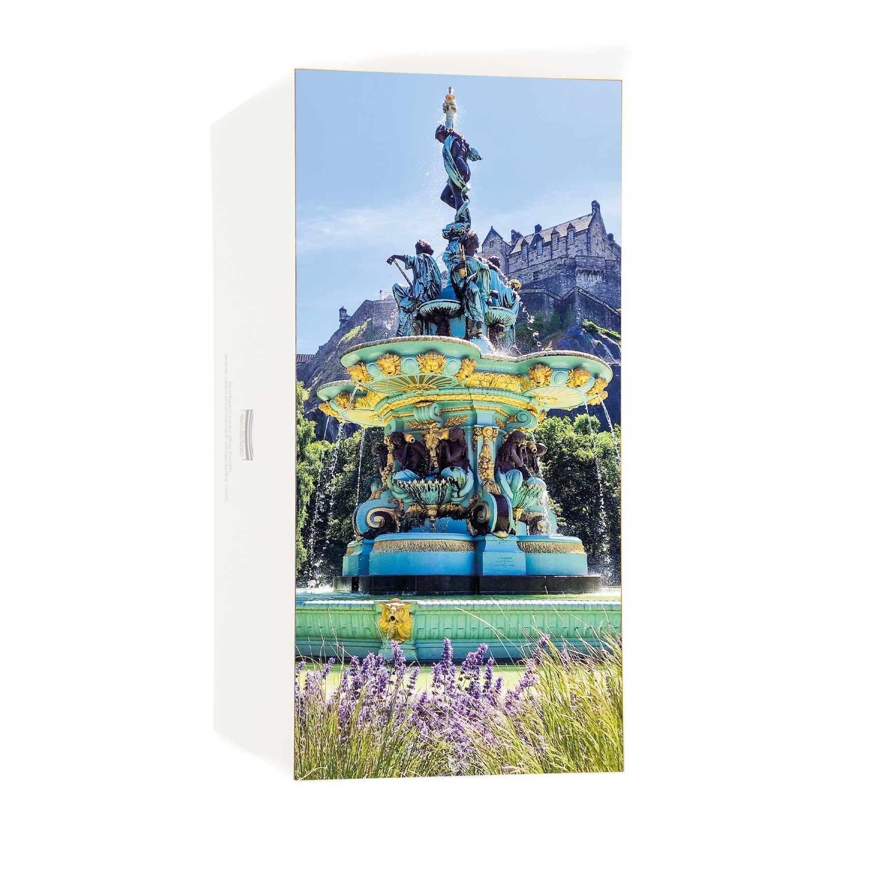 An image of the Ross Fountain and Edinburgh Castle on a card. 