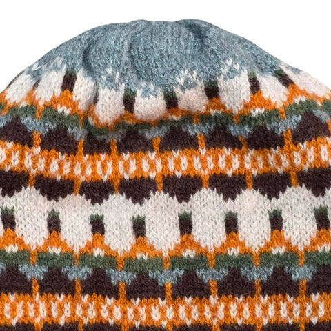 This orange, navy, blue and white striped woollen hat is handmade using only the softest Scottish spun lambswool.