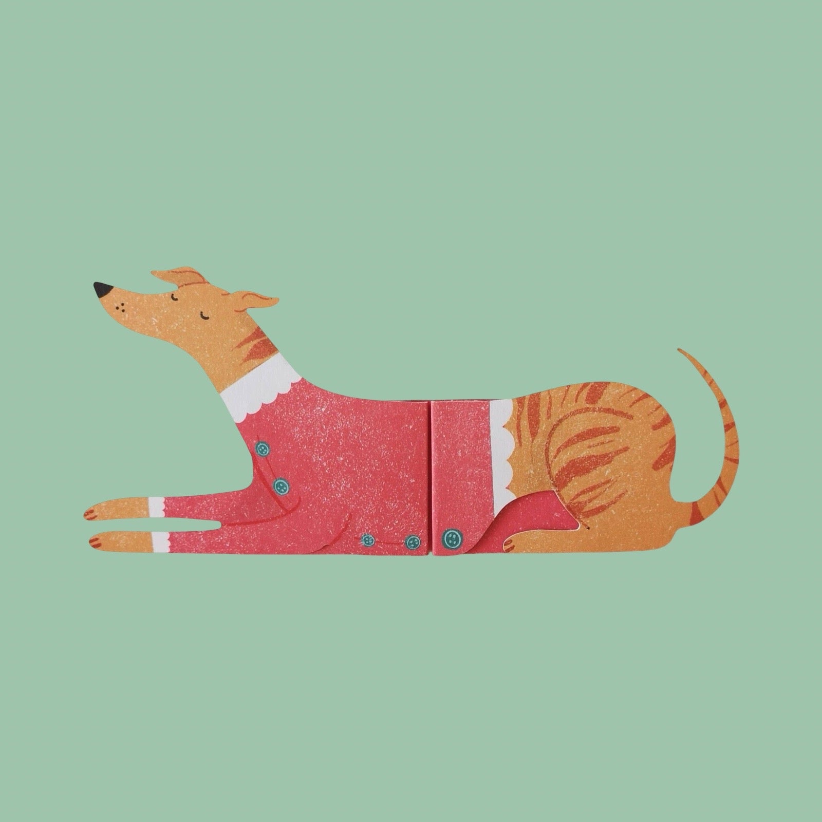 Card of a dog in a Christmas outfit on a green background.