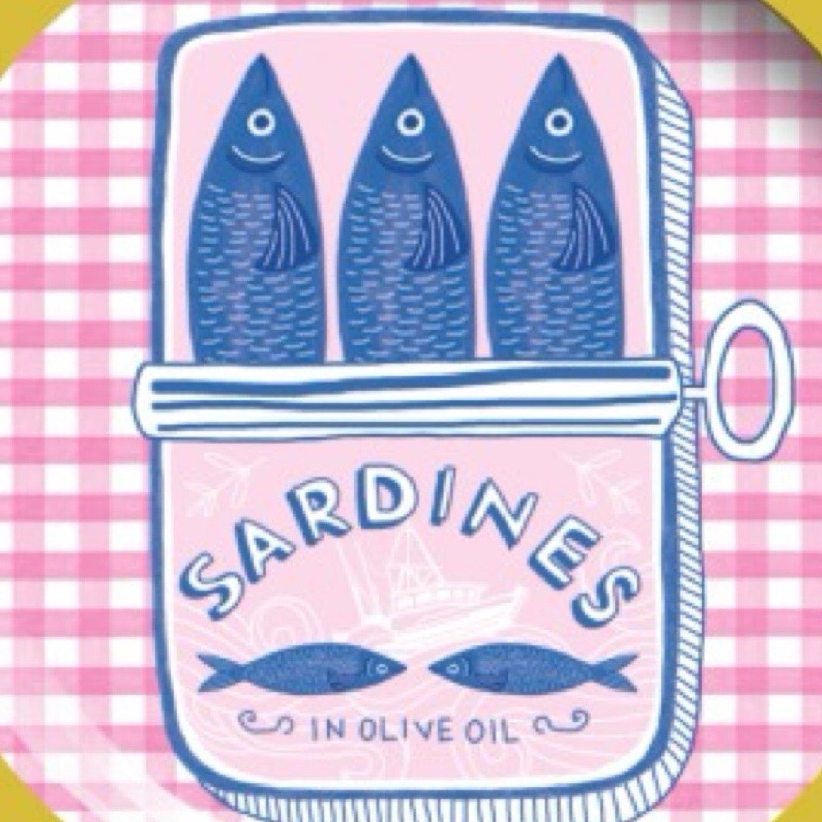 Round plate with yellow rim featuring a design of sardines in a can on a pink checkered background.