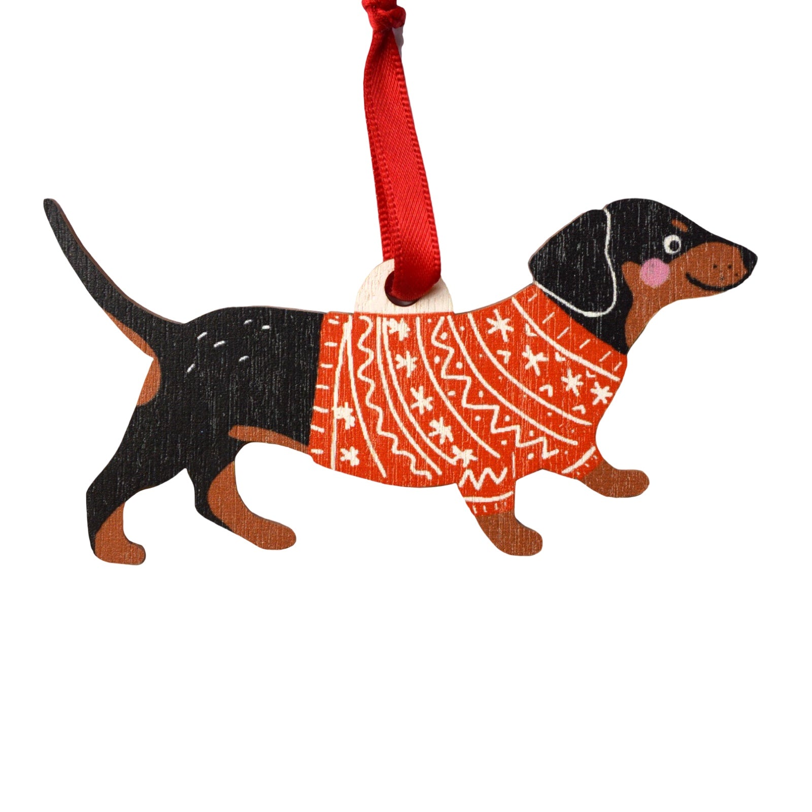 Dog-shaped ornament wearing a red sweater with white patterns on a white background.