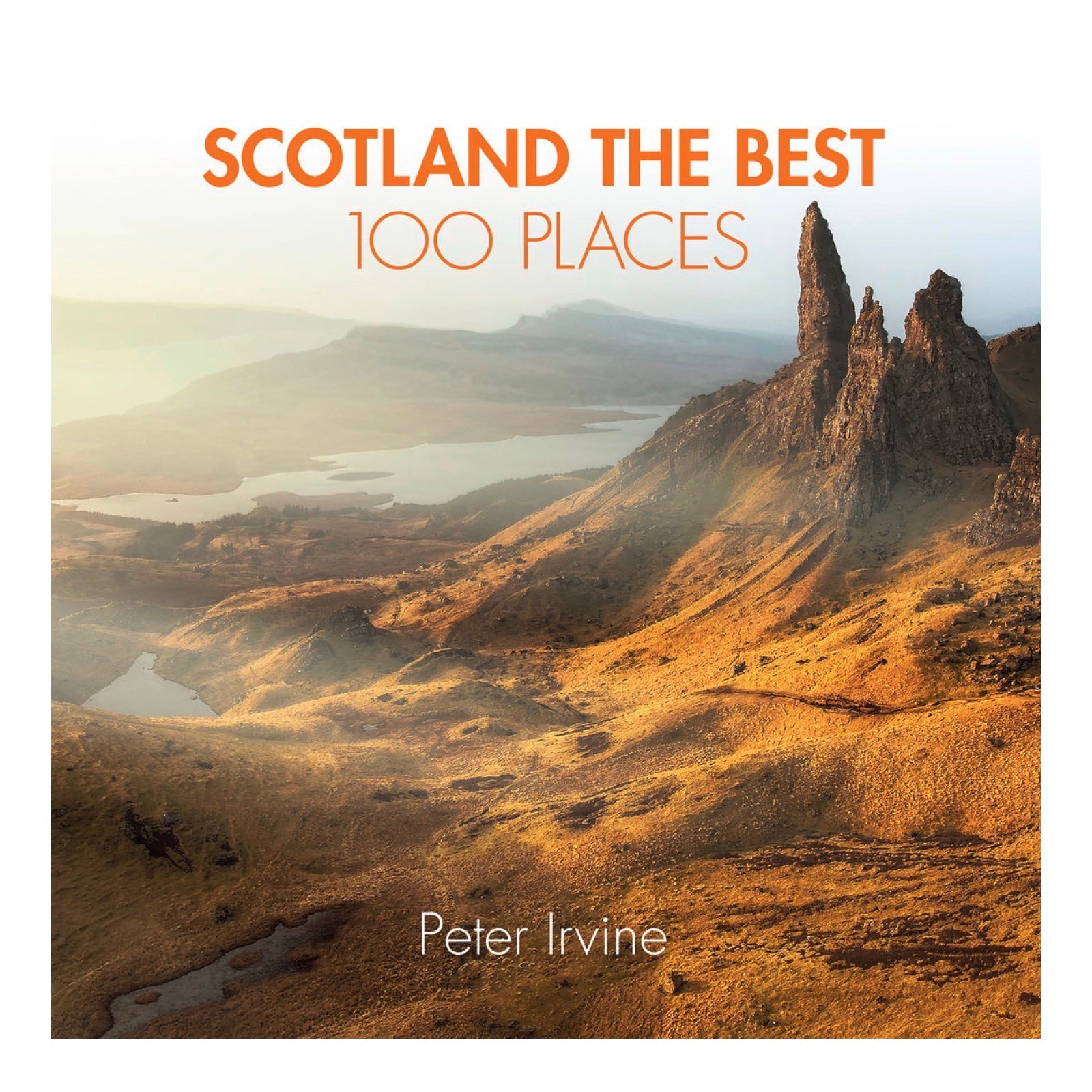 the front cover of the Scotland the Best 100 Places book showing hilly landscape with lakes and rocks.