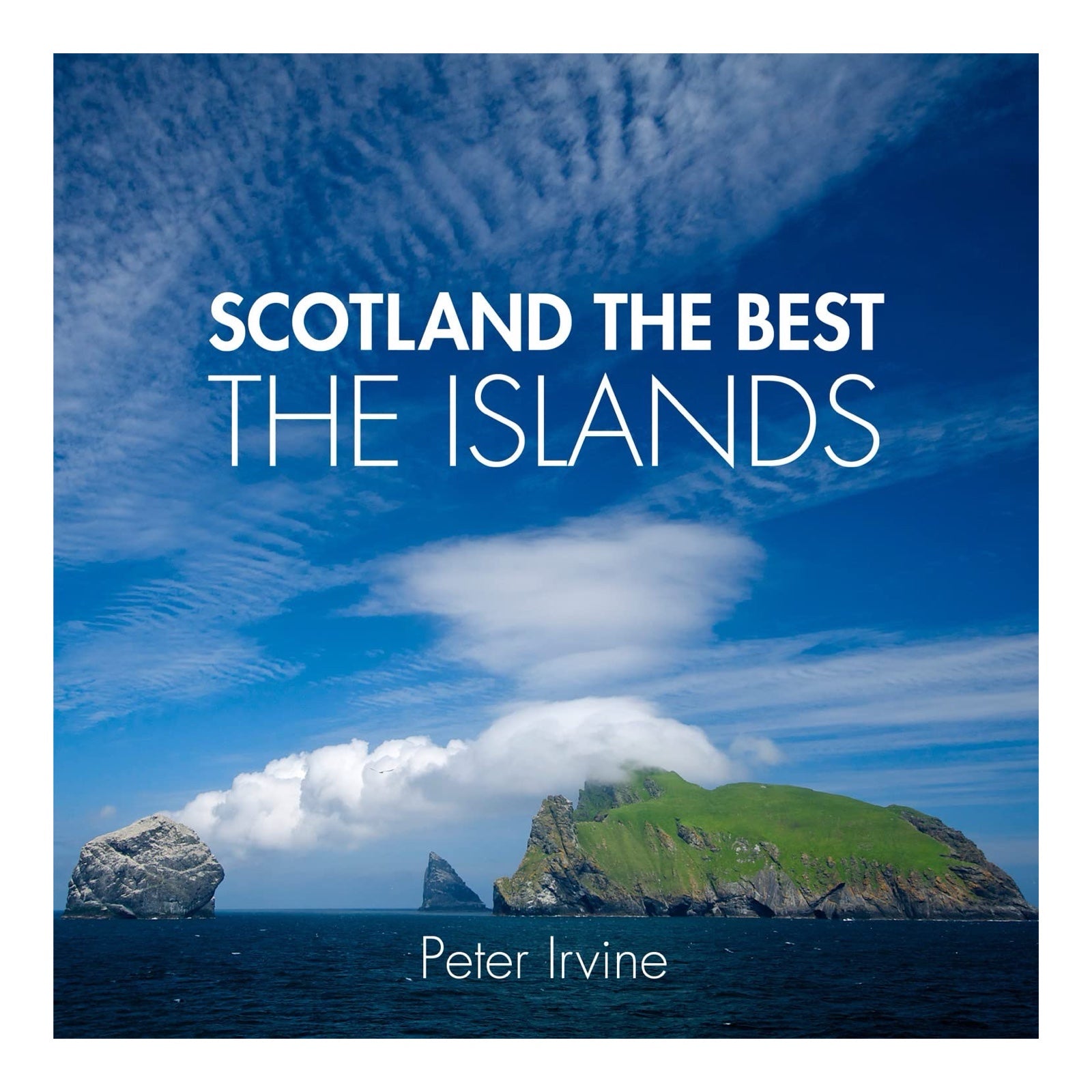 The front cover of the Scotland the Best The Islands book showing rocky landmarks in the sea.