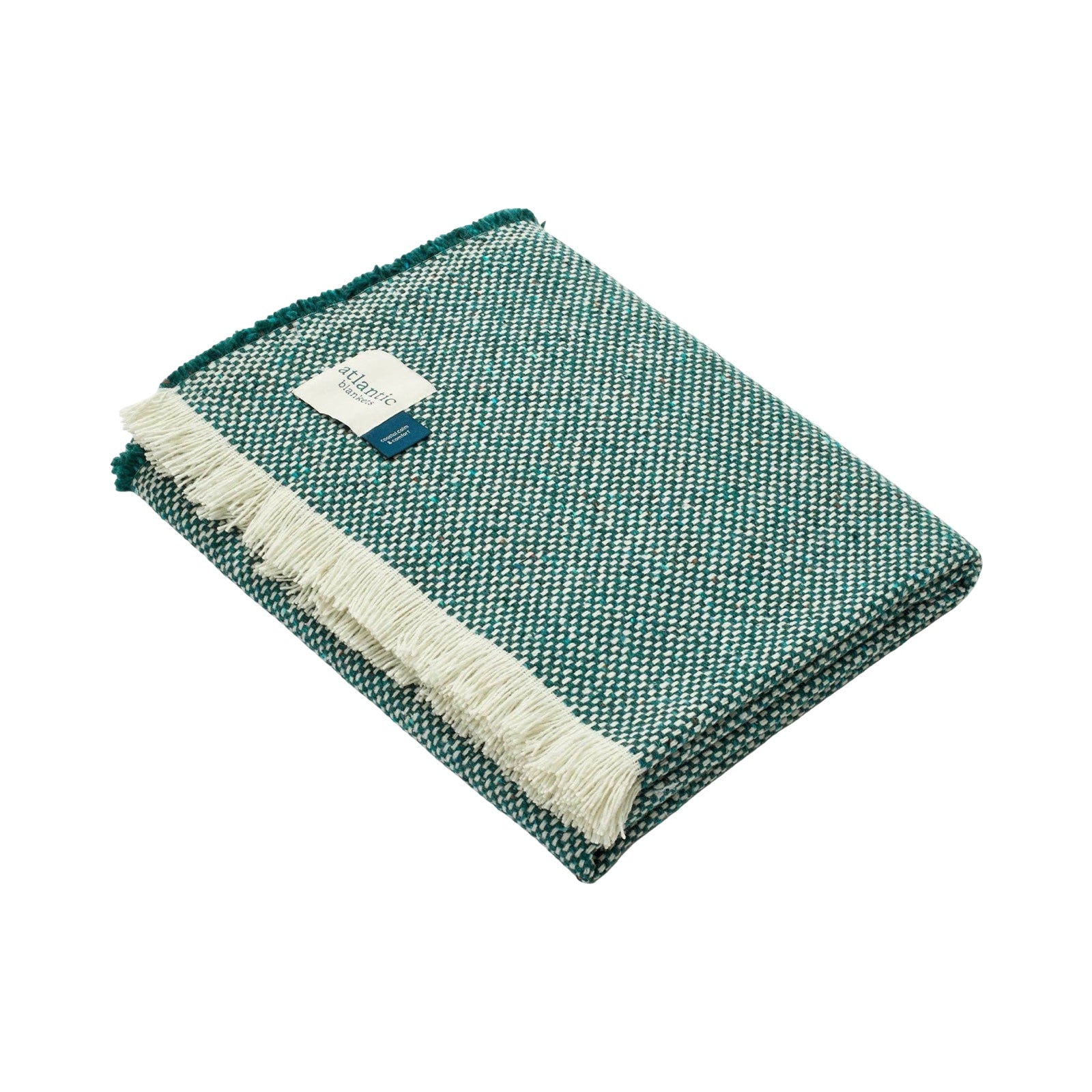 Cosy green blanket folded up.