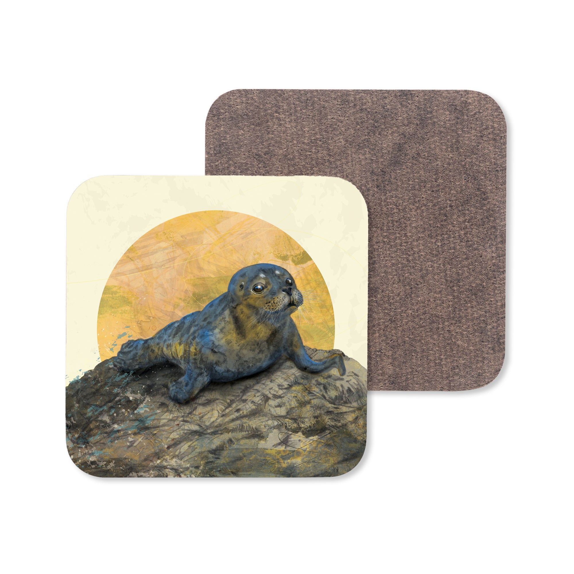 A coaster featuring an illustration of a common seal basking on a rock under the moon.