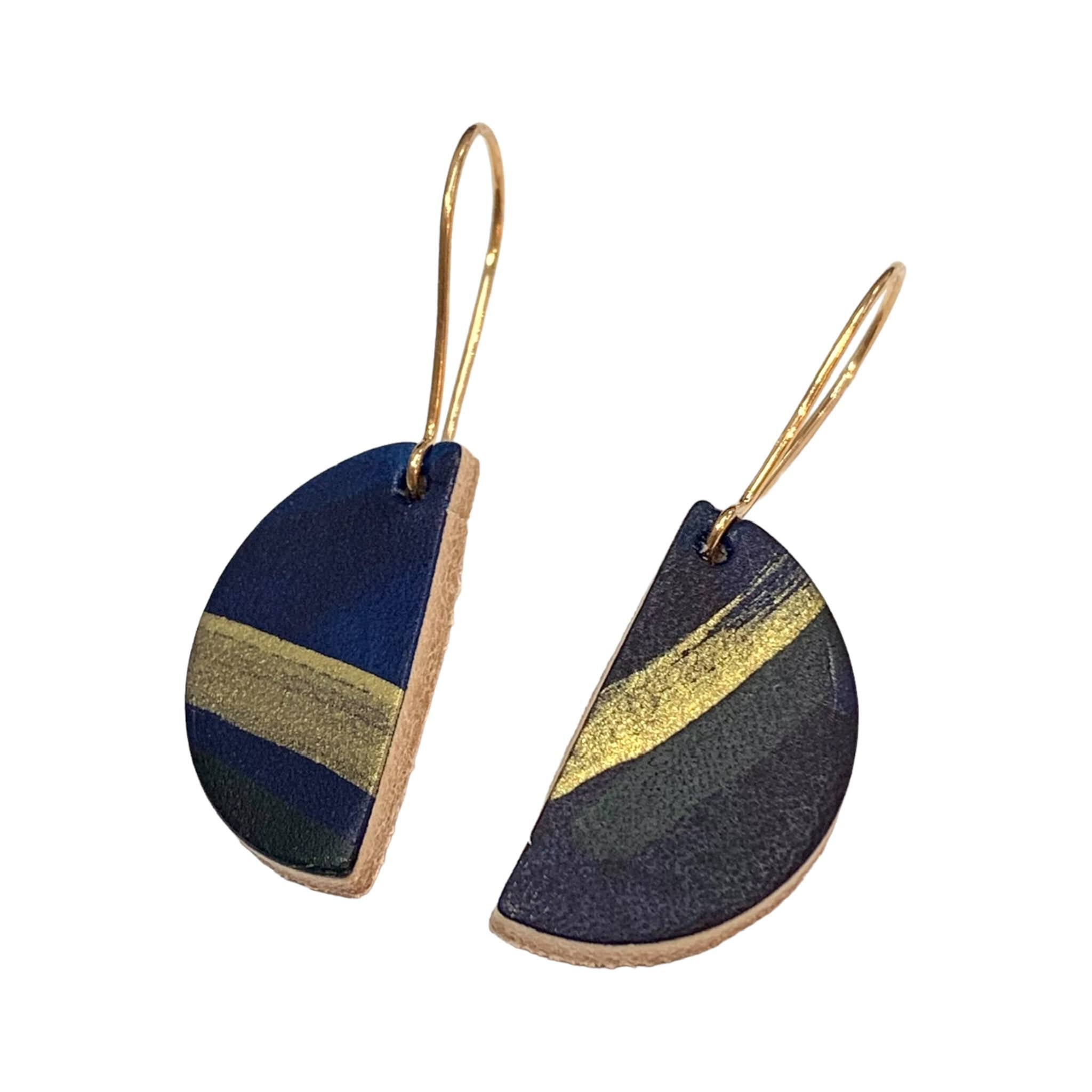 These semi circle drop earrings are crafted with hand-painted lightweight leather.
