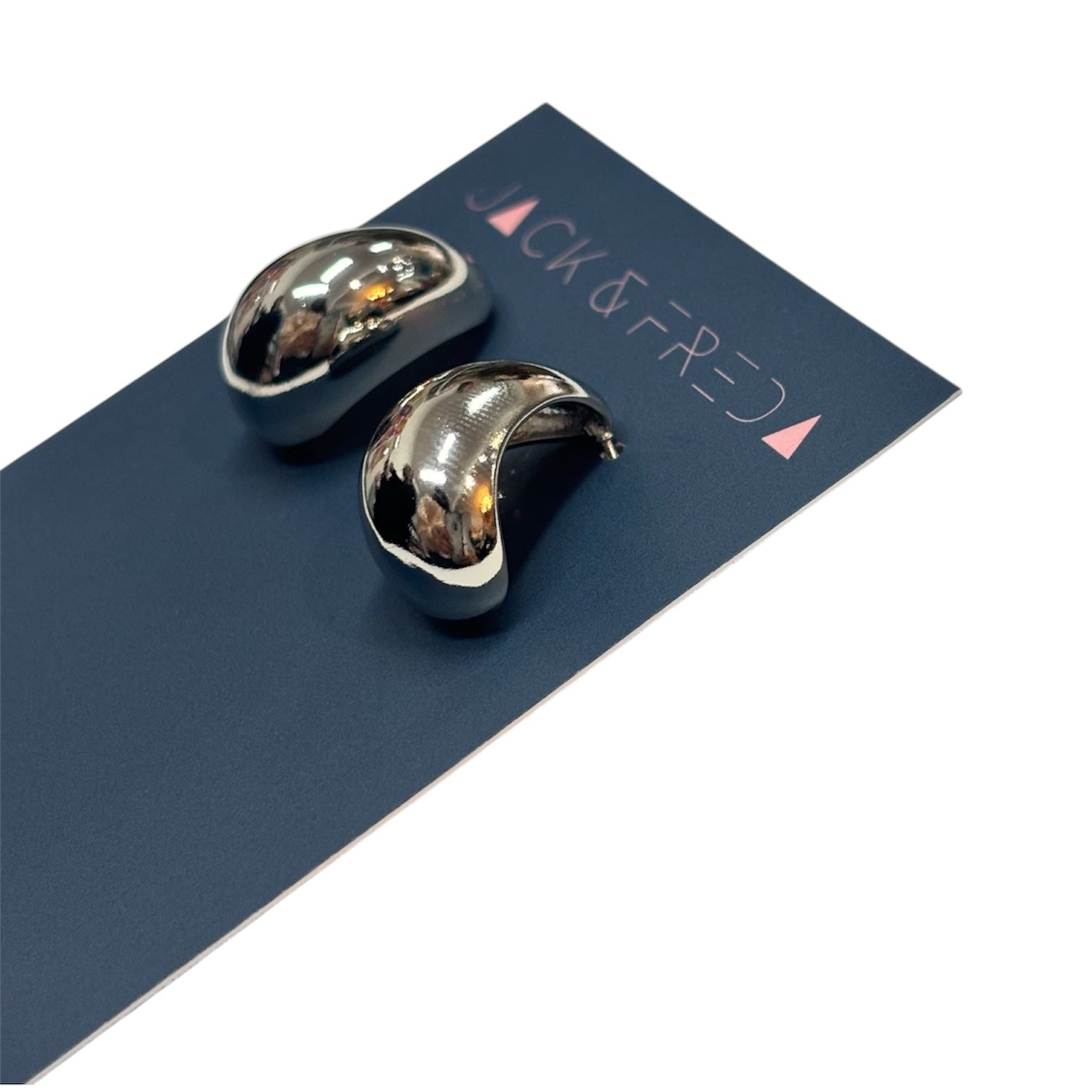 Silver earrings on a blue card with 'Jack & Fred' branding.