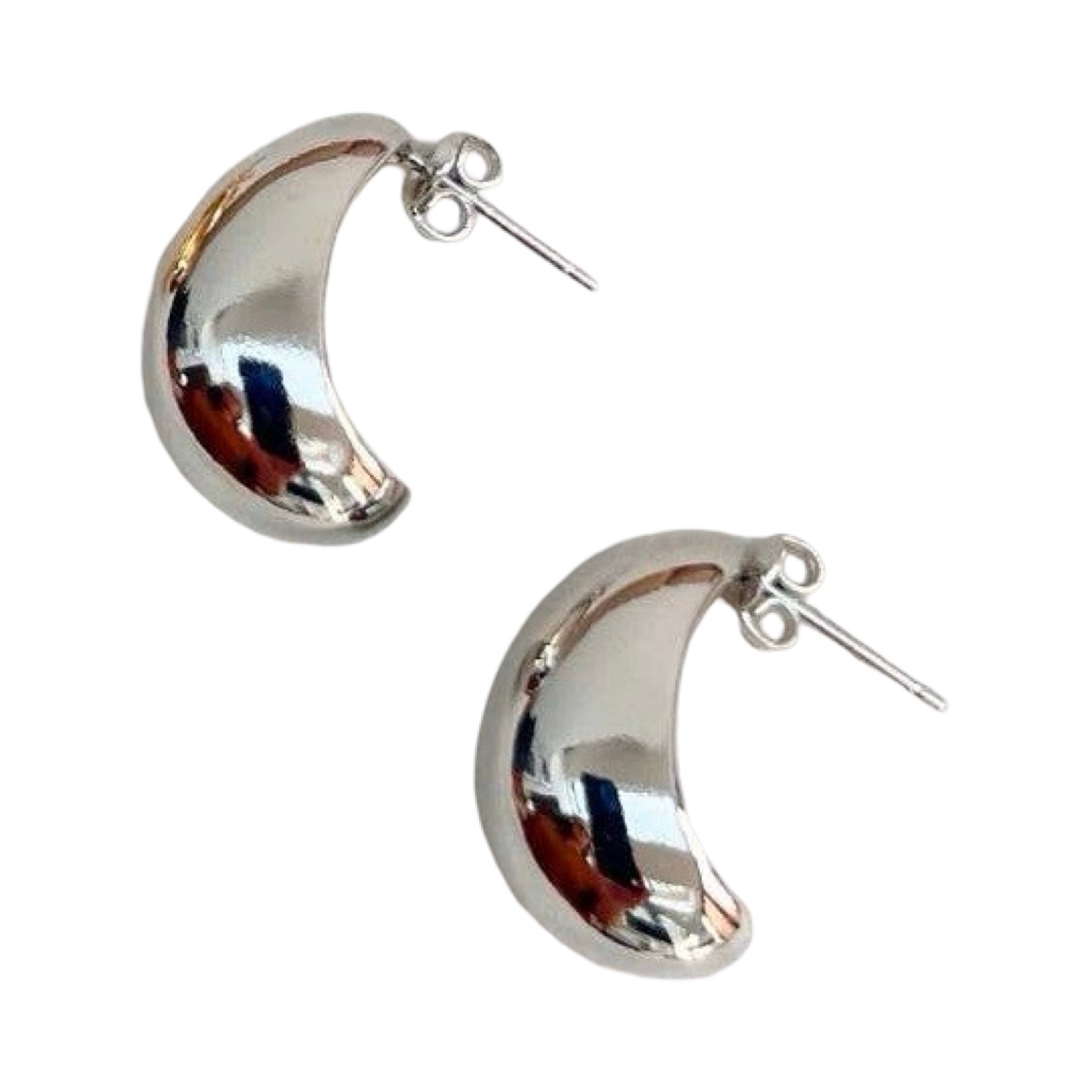Silver crescent moon-shaped earrings on a white background.