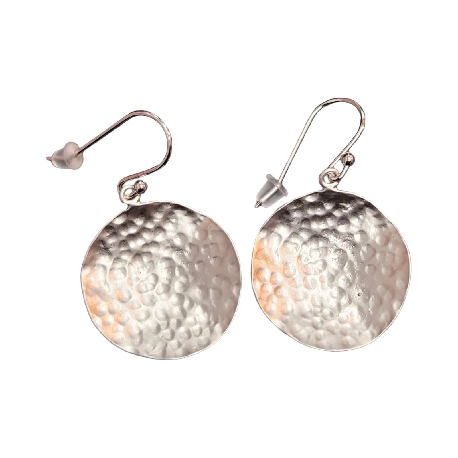 Pair of silver round hammered earrings on a white background.