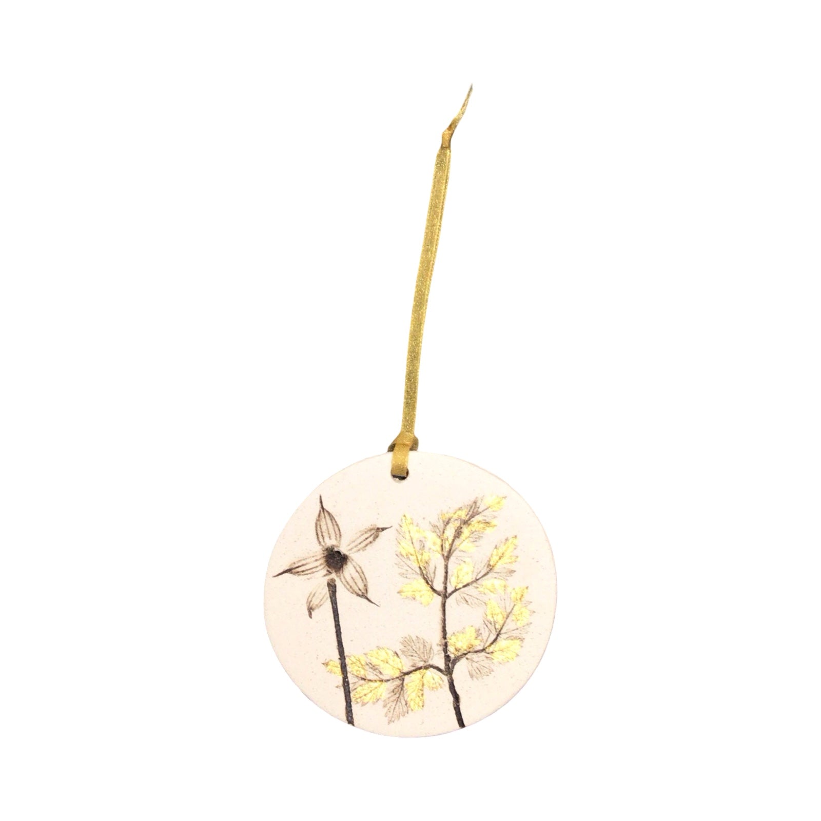 Round ceramic ornament with floral design on a white background