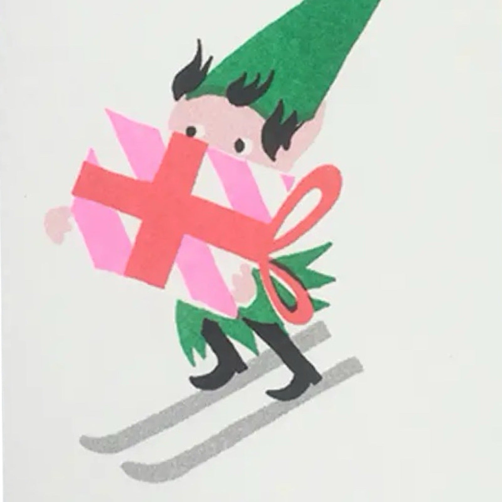 Christmas card featuring an elf skiing holding a giant Christmas present.