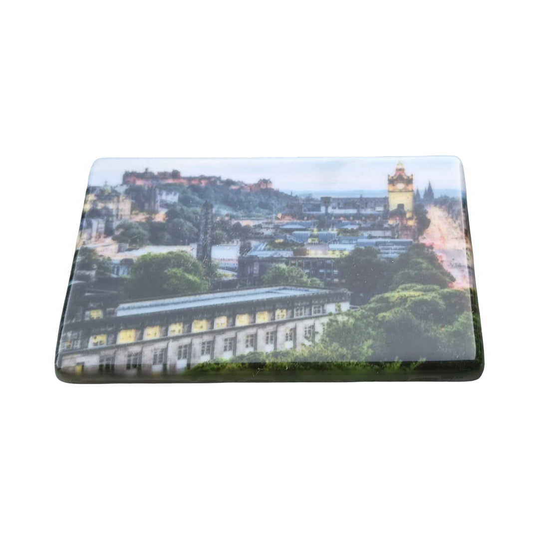 An image of a ceramic tile magnet with a picture of Edinburgh on it. 