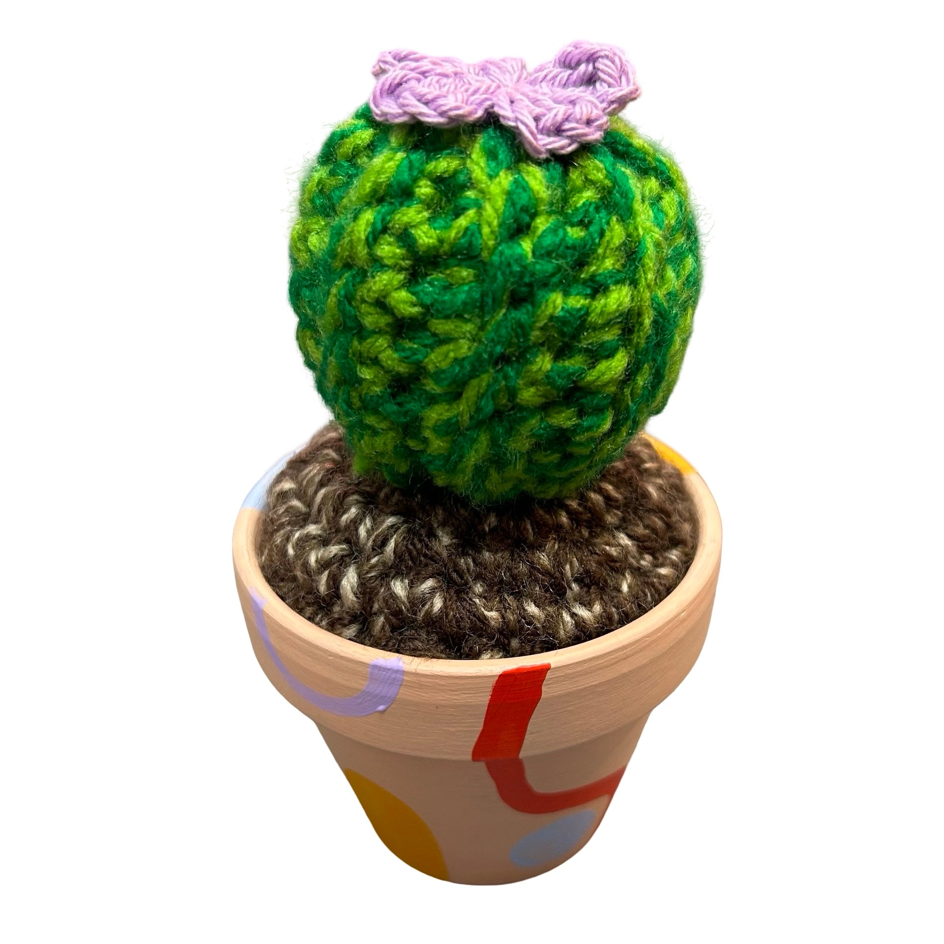 Small round crochet cactus with a purple flower.  Hand painted peach pot with colourful abstract design.