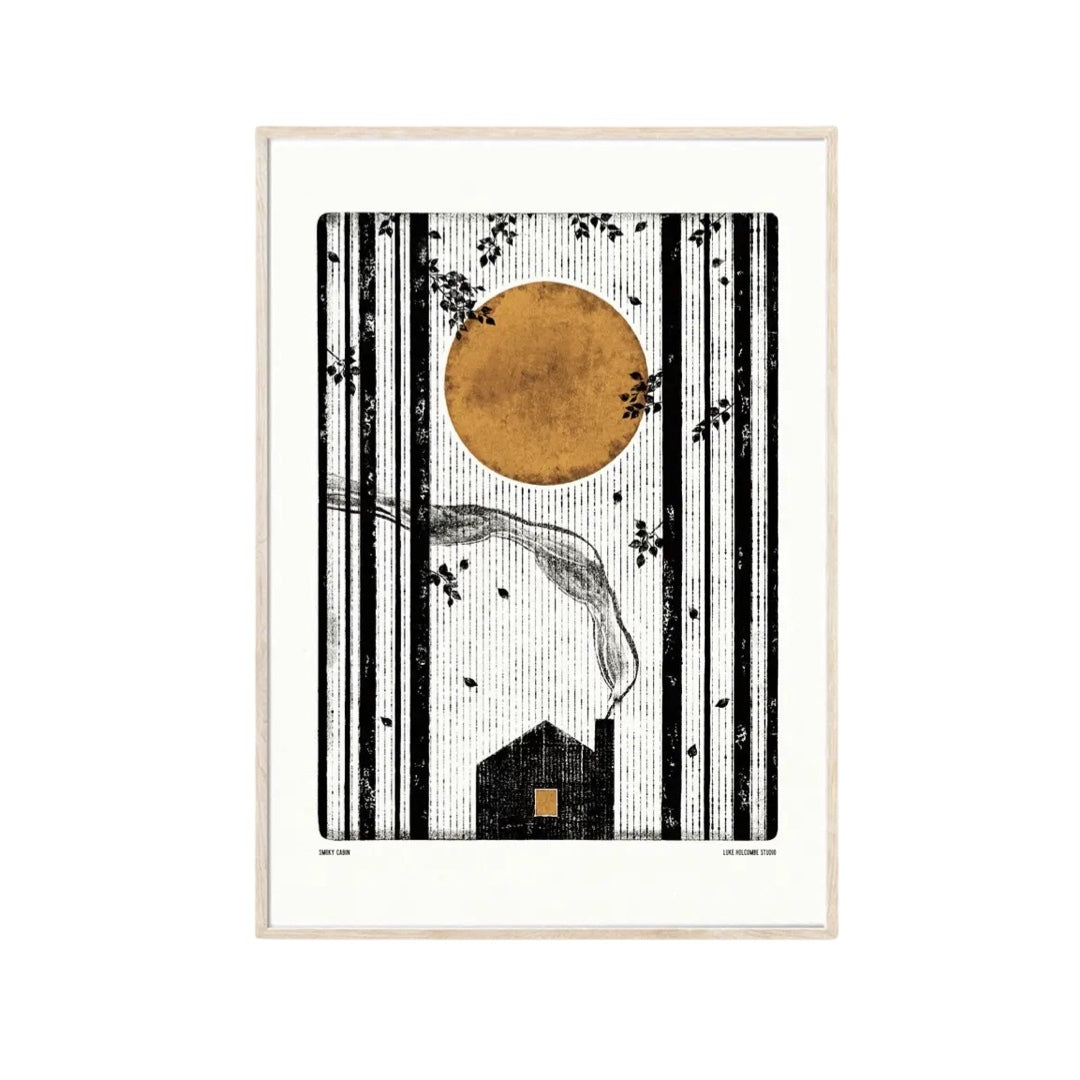 Black and white print featuring a cabin in the forest with smoke coming out the chimney, and a mustard-coloured moon in the sky.