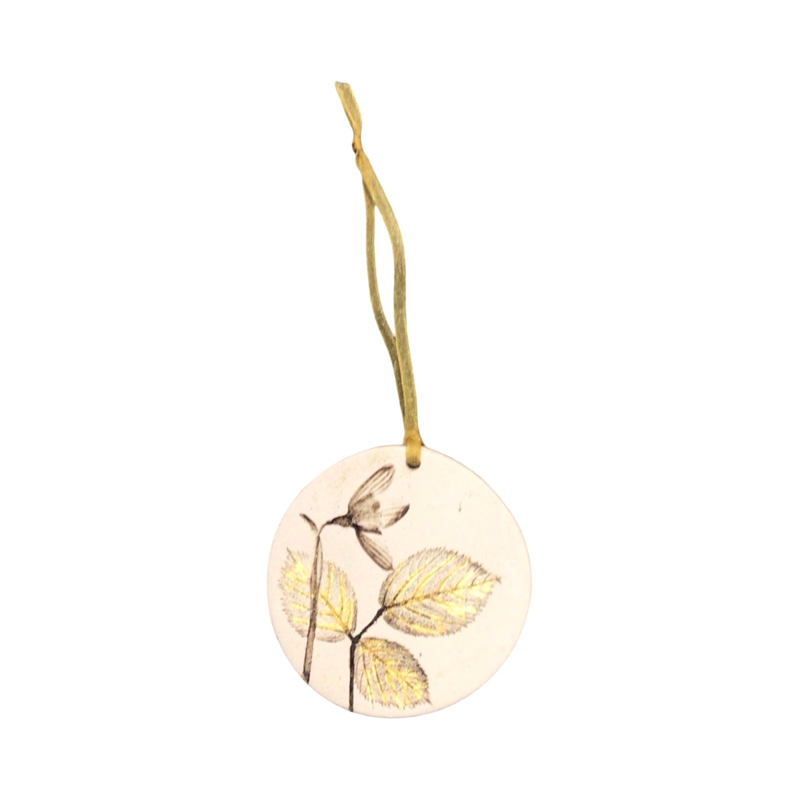 Round decorative tag with leaf design and string on a white background