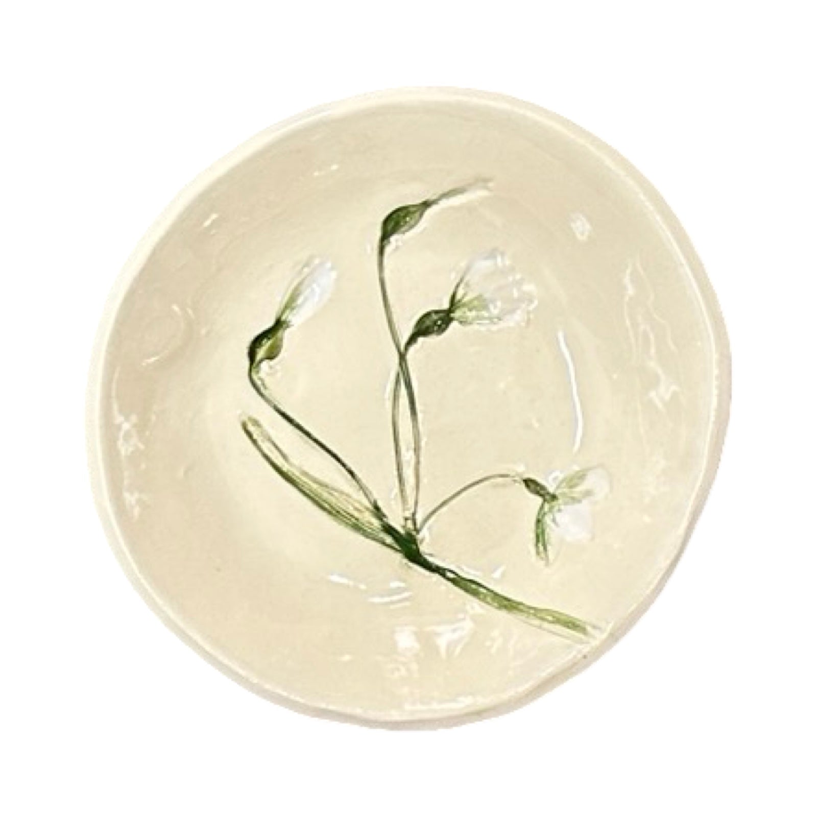 Ceramic dish with floral design on a white background.